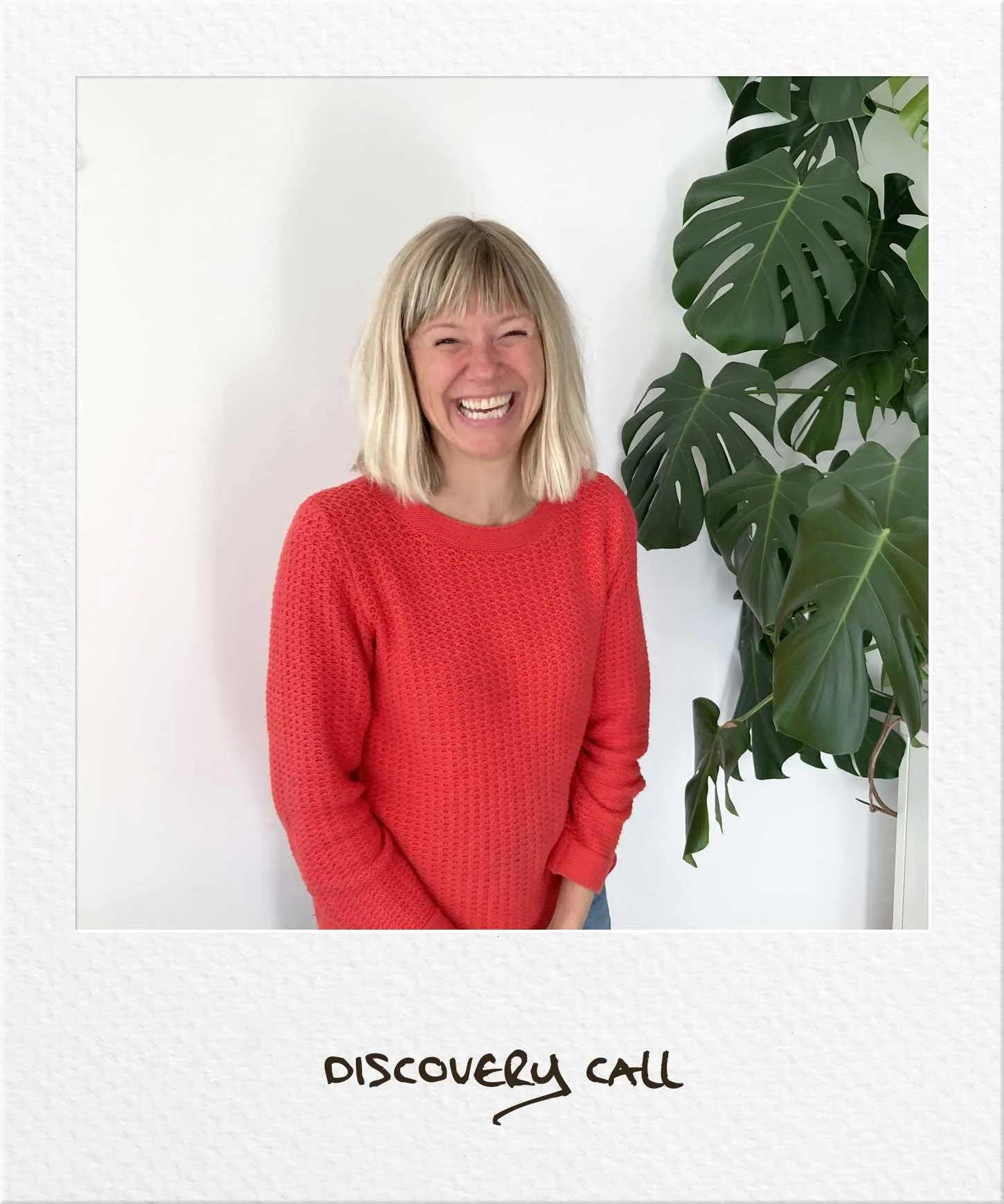 Woman wearing red top smiling in a polaroid, text 'discovery call'