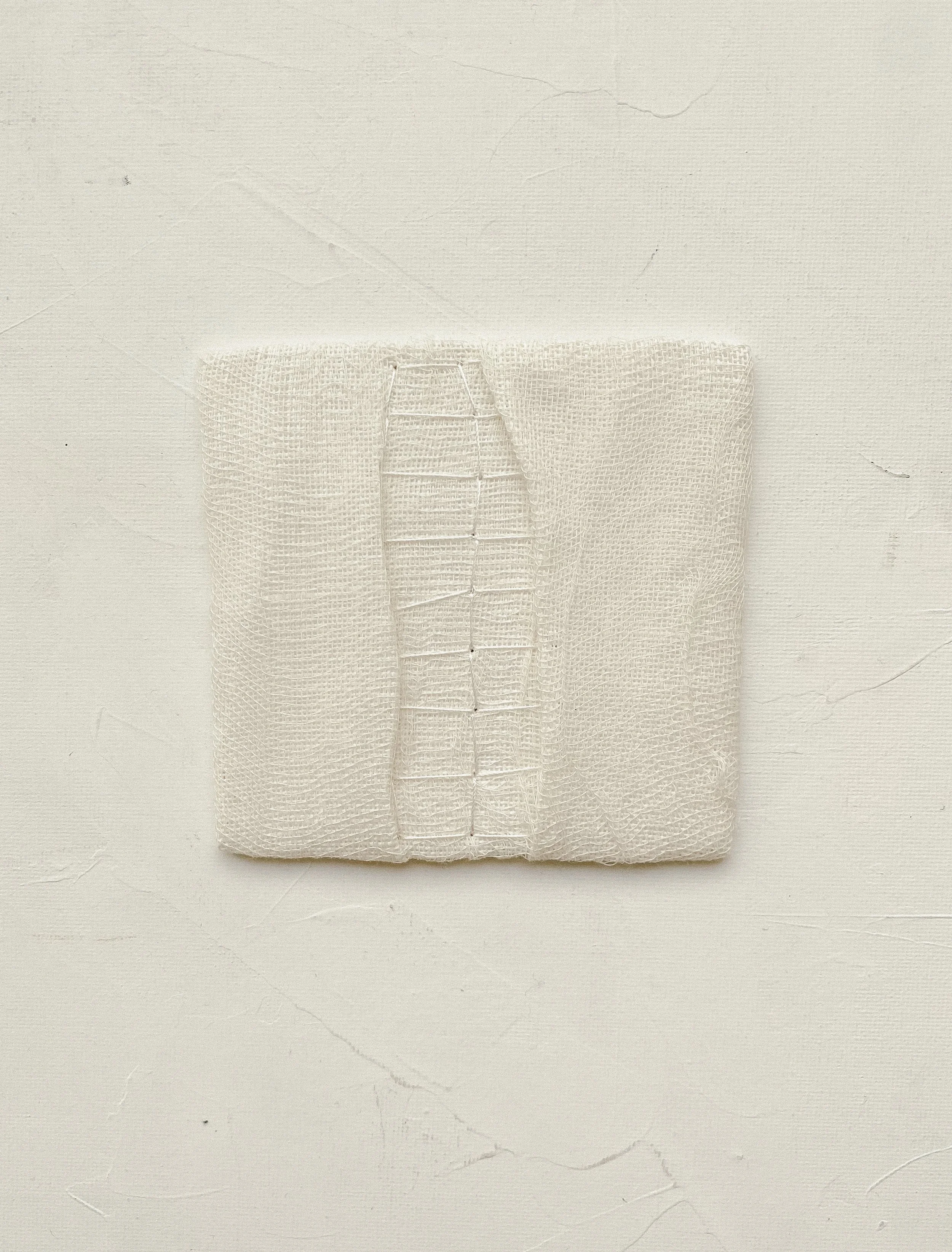 Minimal textile wall art unframed, dimensions are 10 by 10 centimeters.