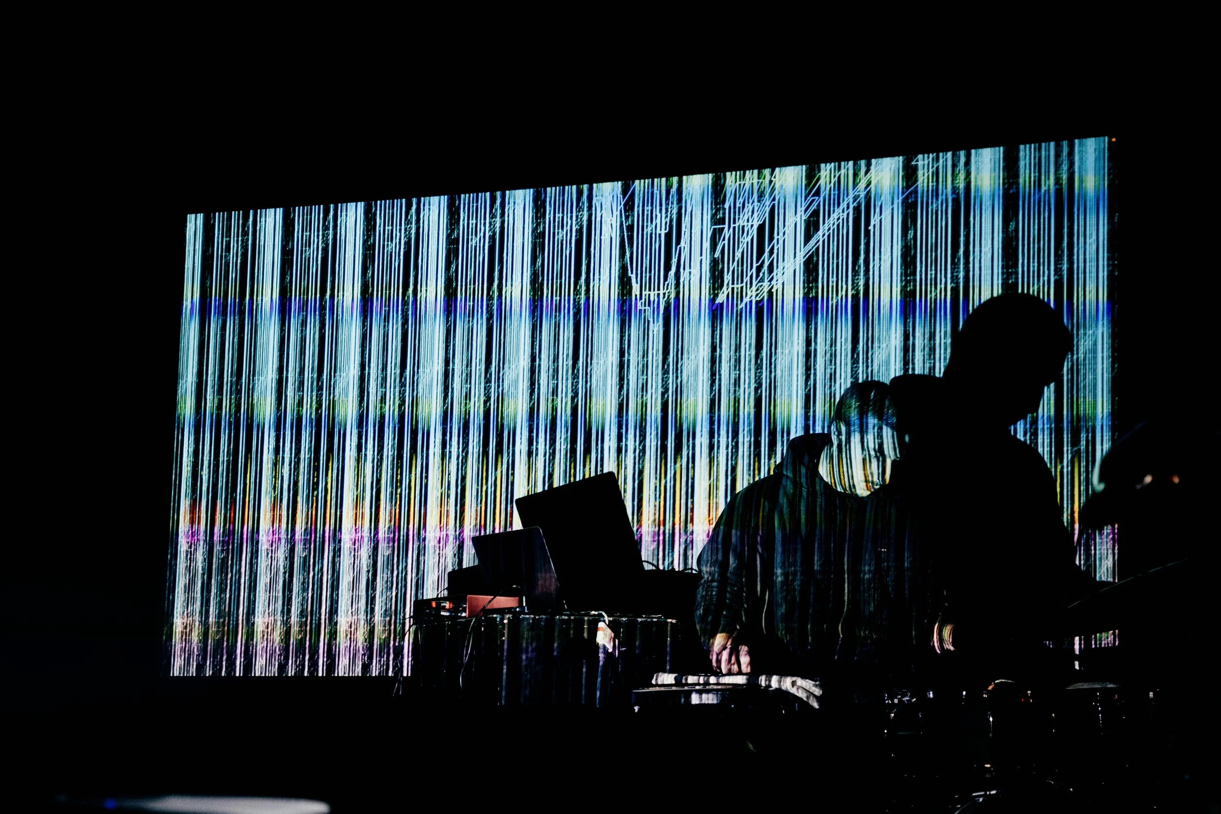 Ilia Rayskin, performing on drums and electronics, accompanied by blue live visuals.