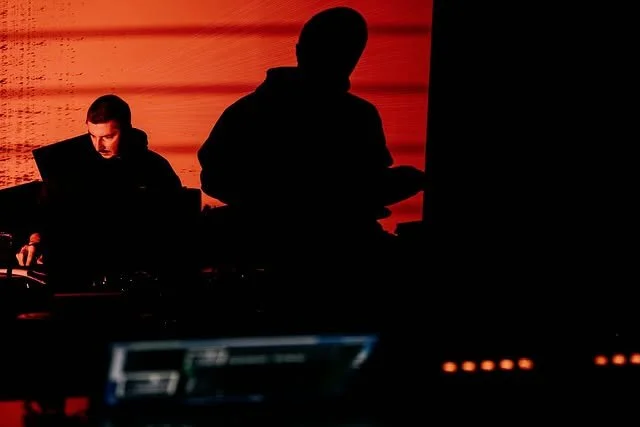 Ilia Rayskin, performing on drums and electronics, accompanied by orange live visuals.
