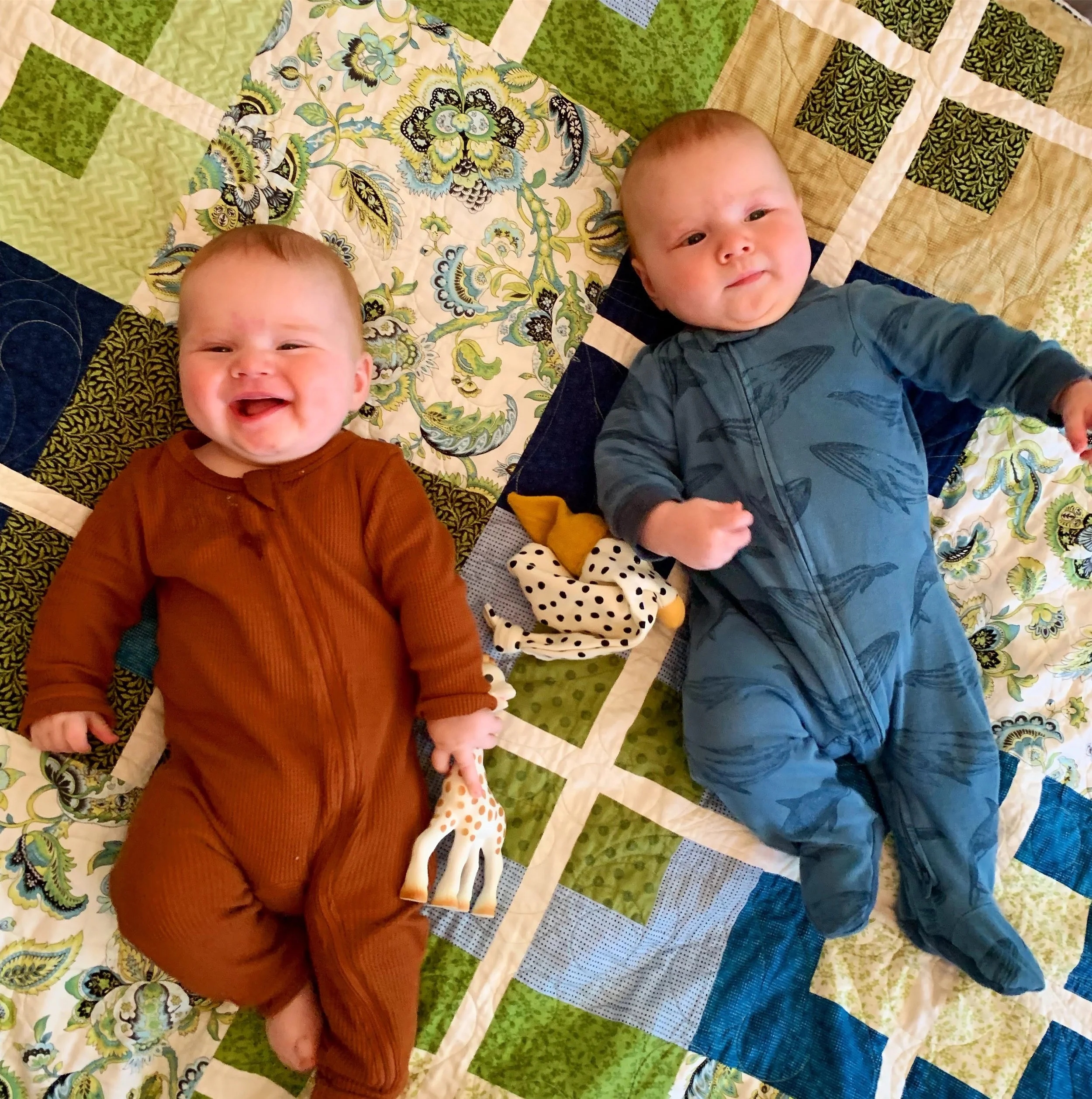 The twins enjoy mom and dads wedding quilt