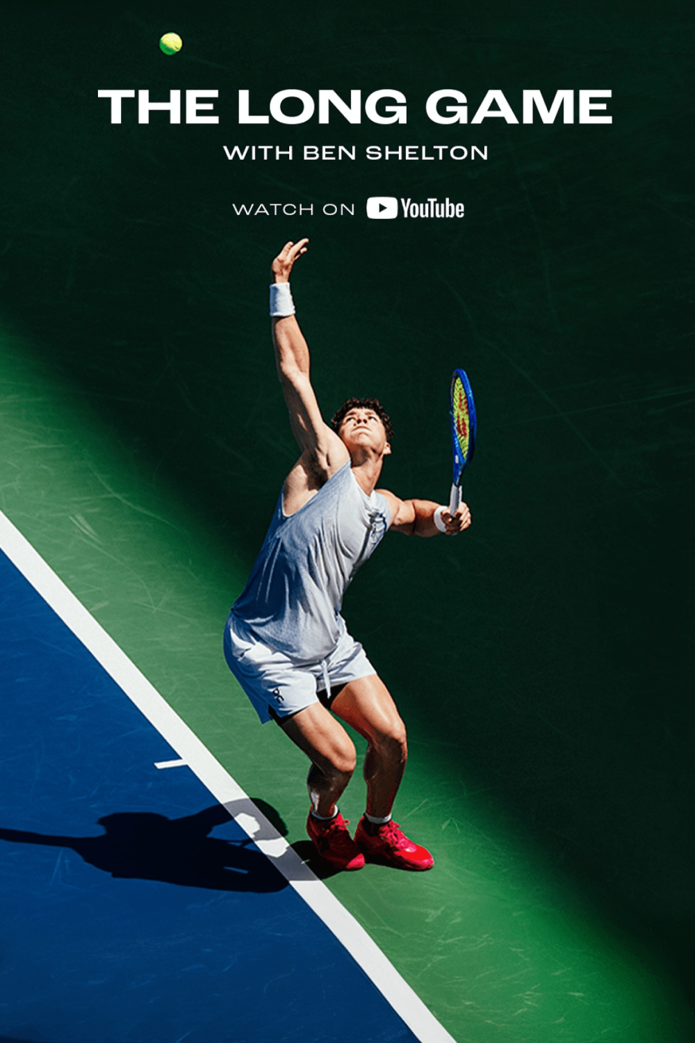 A male tennis player preparing to serve on a tennis court with green and blue surface. Text overlays indicate the title 'The Long Game' with Ben Shelton, and a YouTube logo.