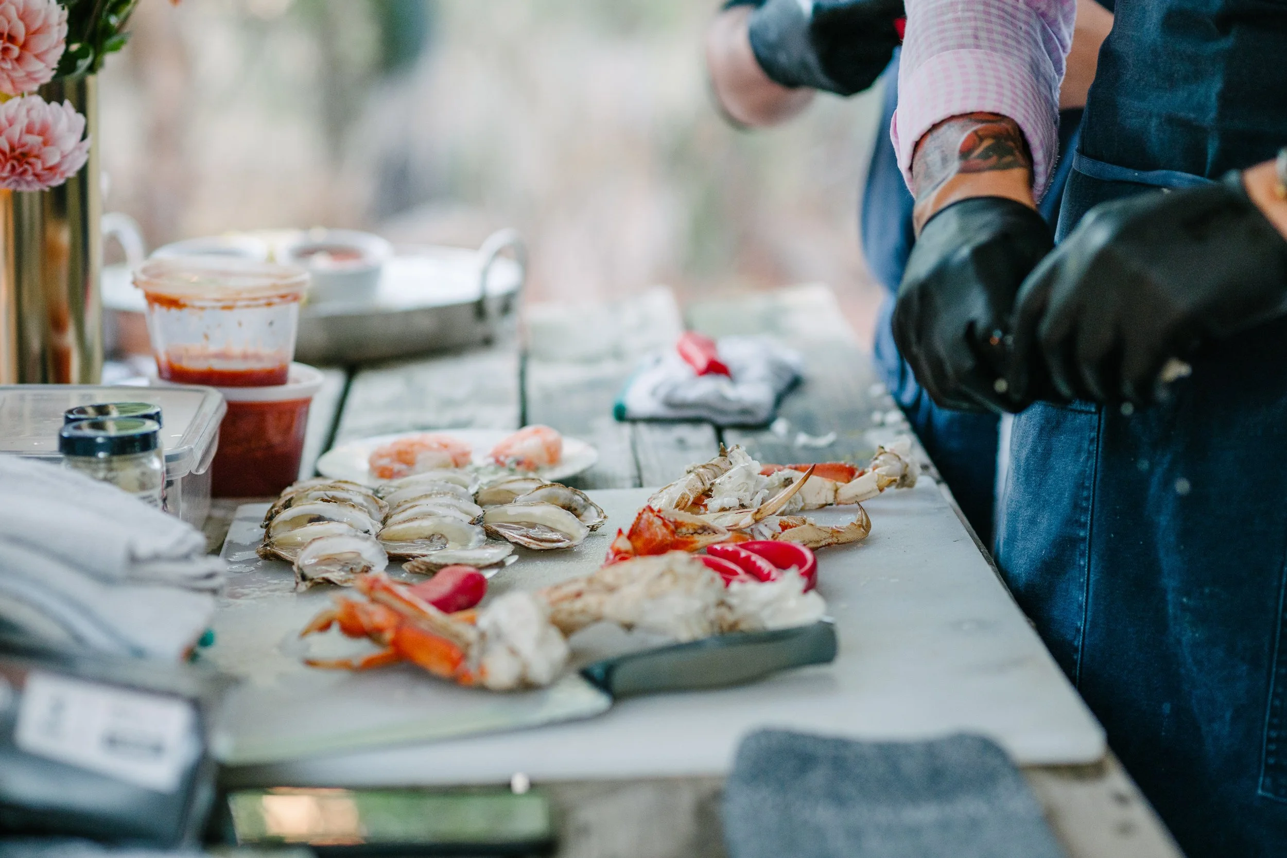 Chef Jesse and Miguel AKA "Young Buck" shucking fresh oysters every day for our lovely guests.