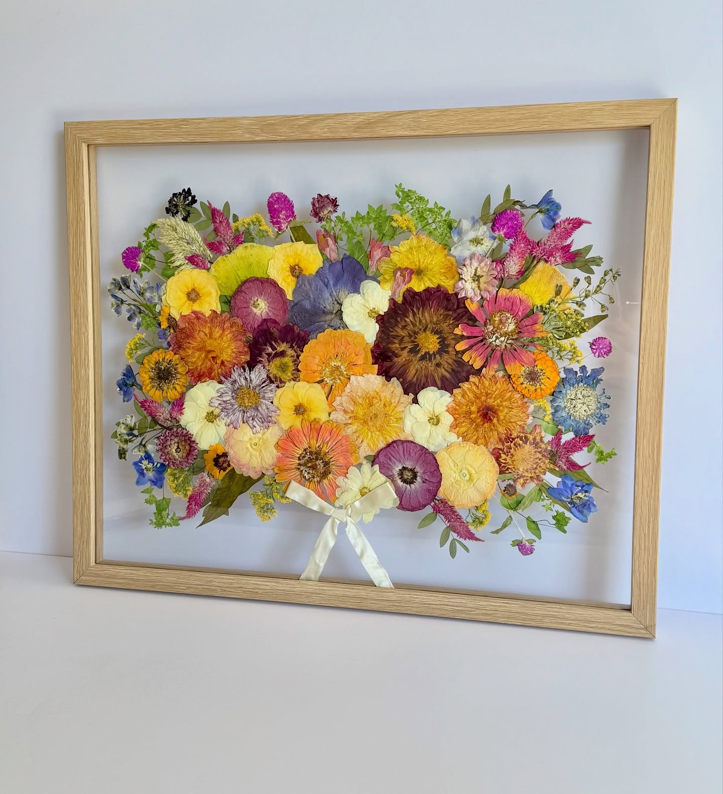 Color explosion for Courtney! 

These florals were a family affair! Her dad grew some of her blooms and made the arch arrangement. Her cousin did the bridal bouquet. And the ribbon is from her grandmother&rsquo;s wedding bouquet from 1944 - 81 years 