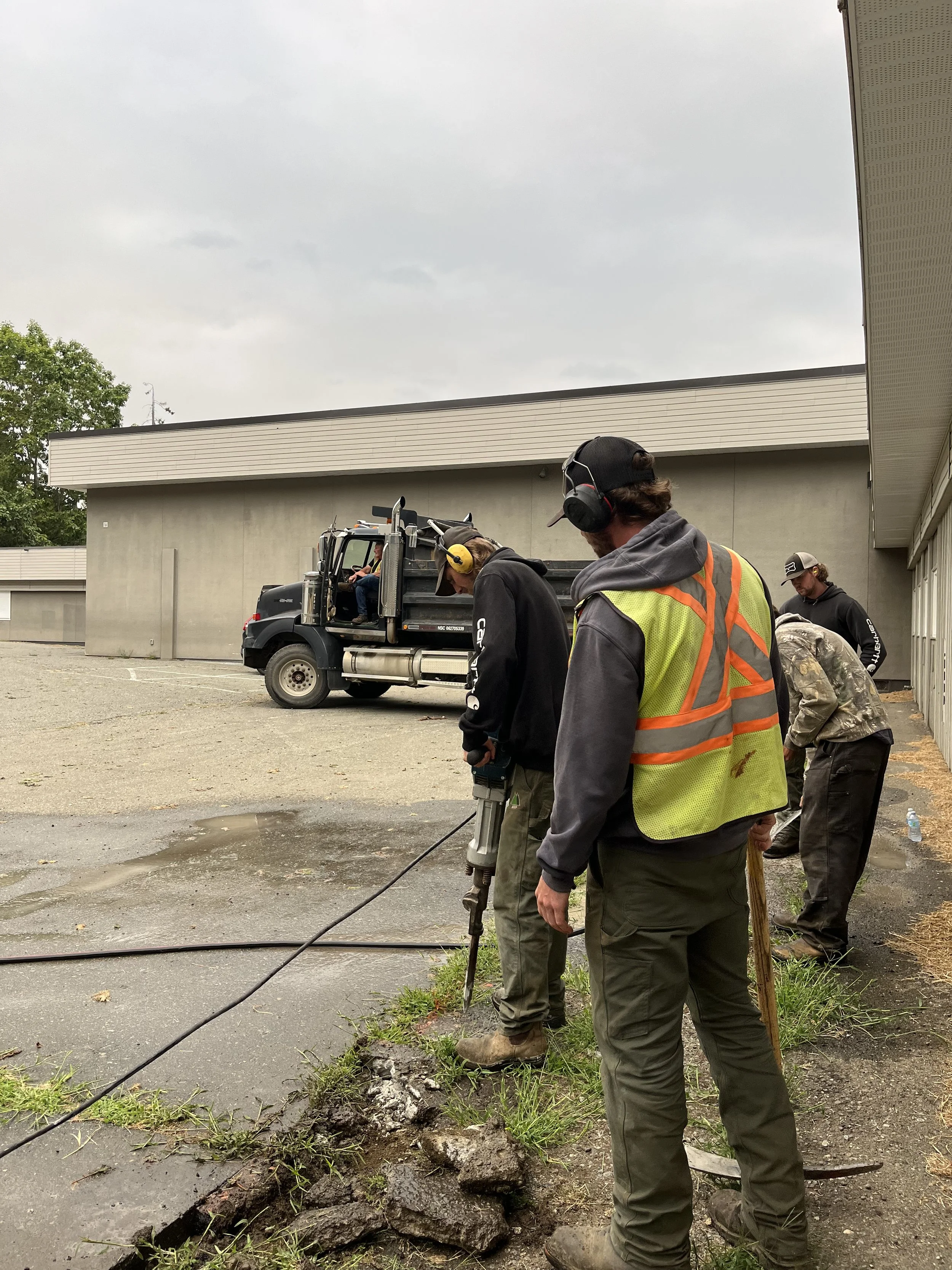 Jackhammer breaking up concrete during demolition work