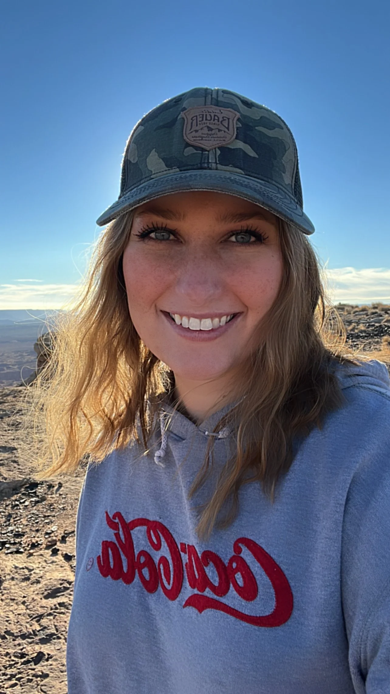 This was taken on top of Tower Butte in Page, AZ while proudly sporting my favorite camo hat and beverage company!
