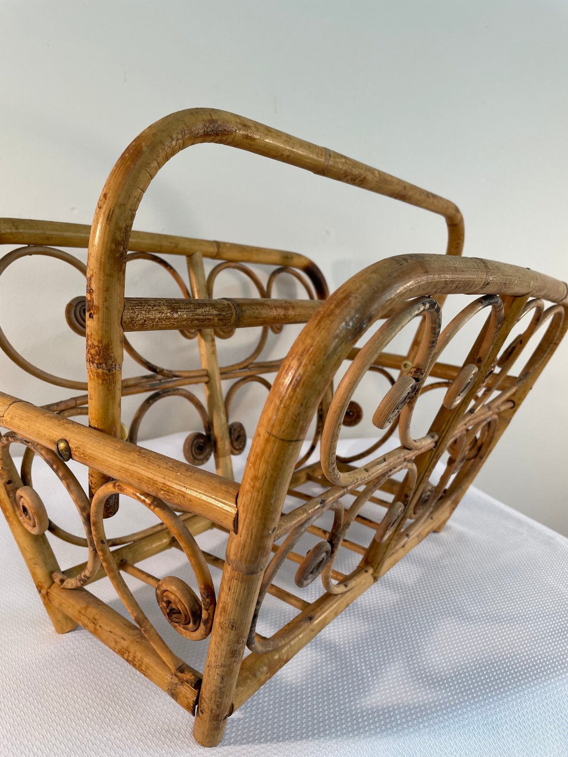 vintage-rattan-magazine-rack-with-swivel-handle-and-curls-3553.jpg