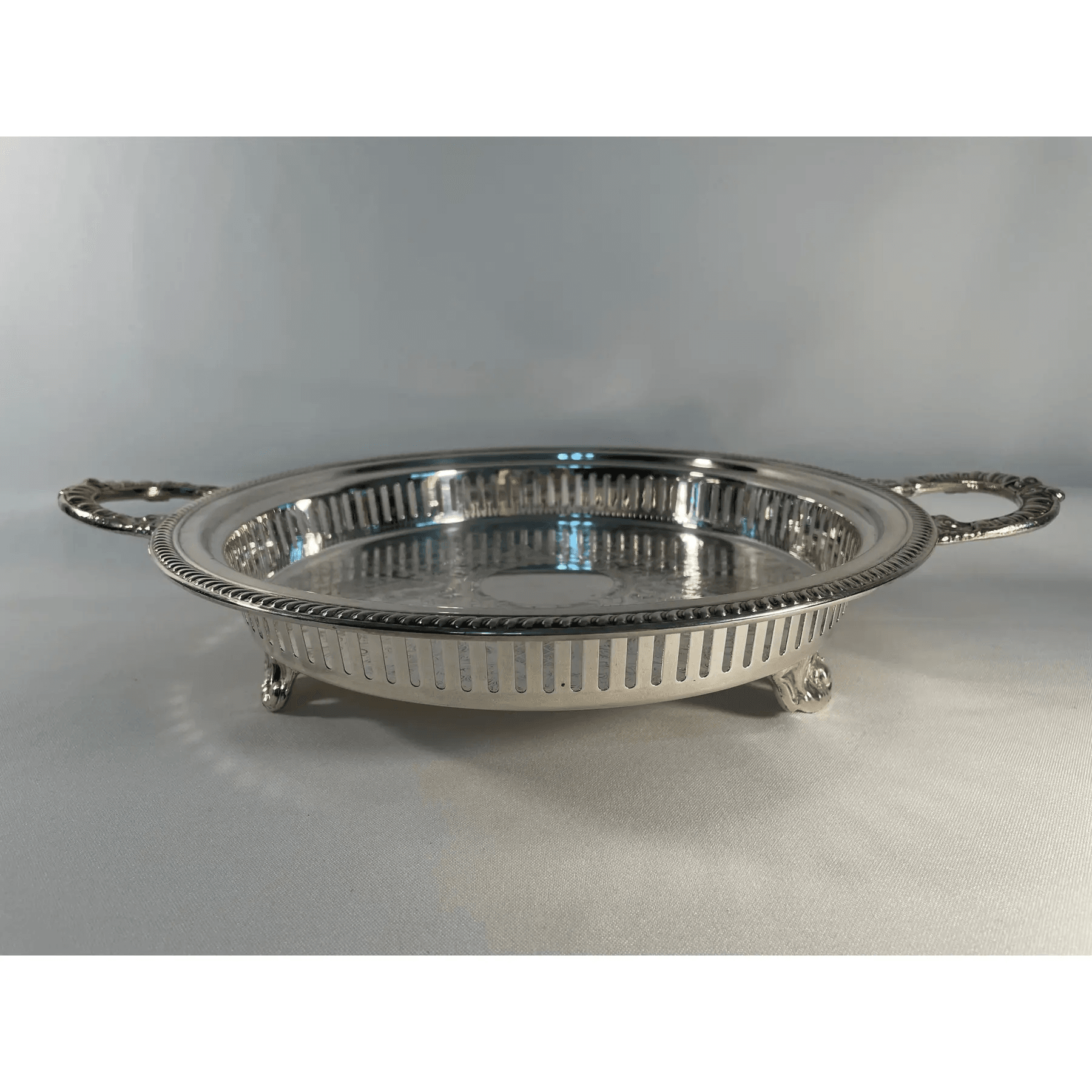 mid-20th-century-round-silverplated-footed-gallery-serving-tray-4362.png