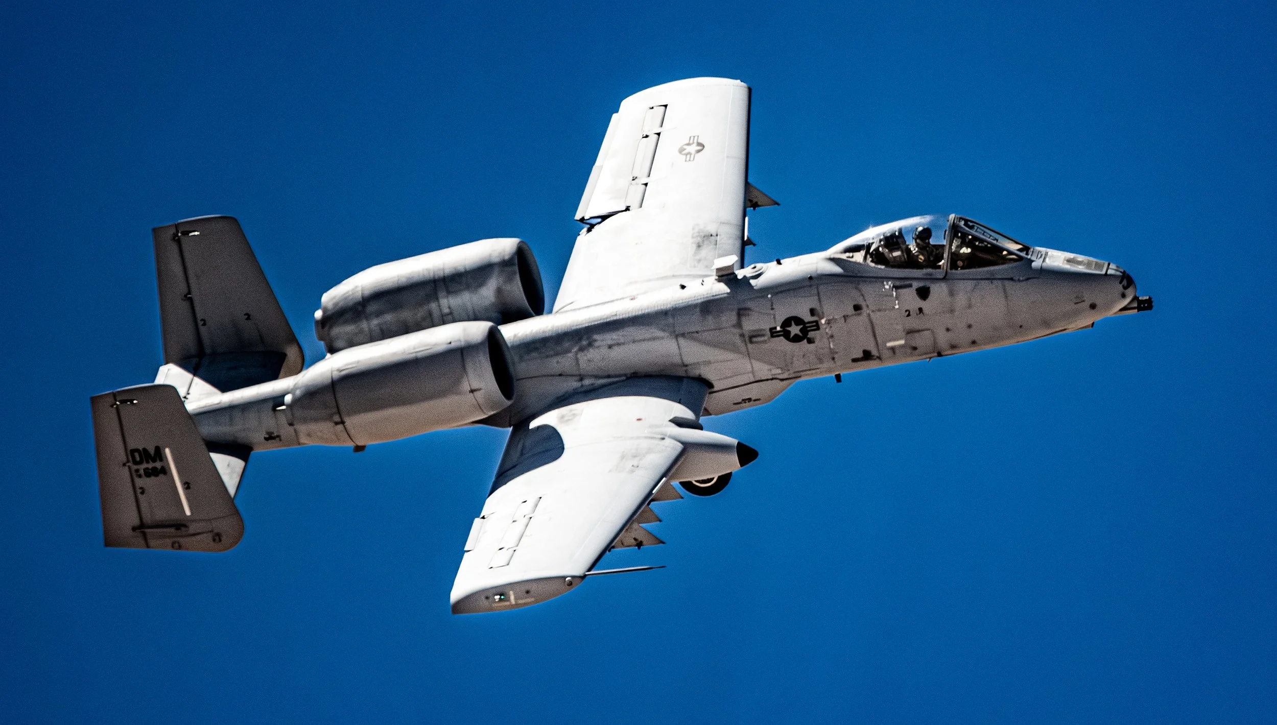 F-35 fighter jet flying in clear blue sky