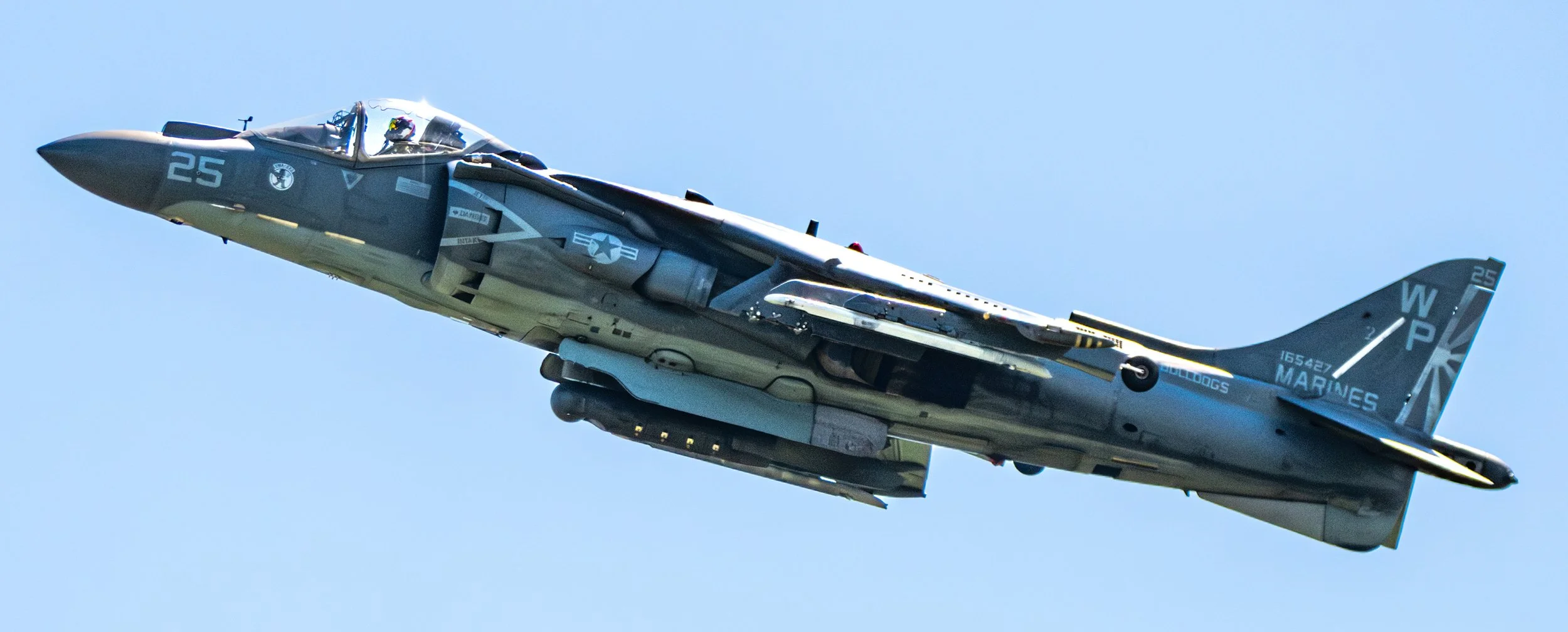 A military fighter jet flying in the sky.