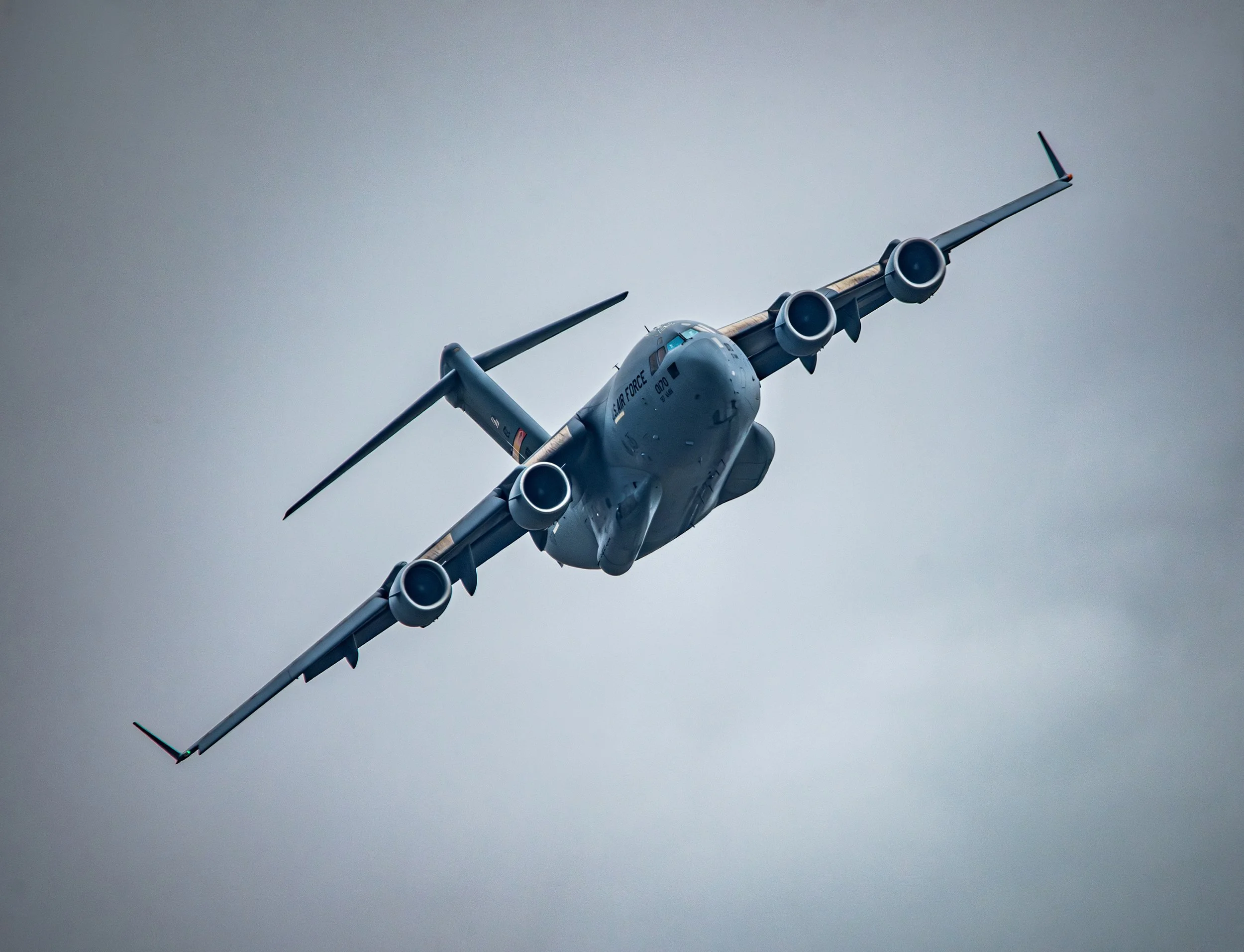 Military cargo airplane flying in the sky.