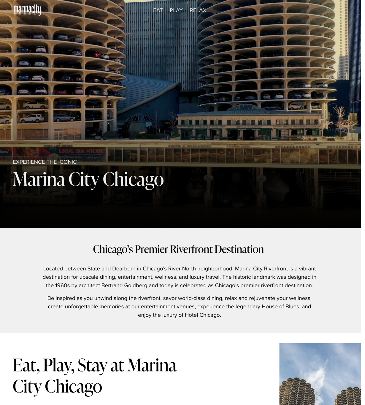 A modern cityscape of Marina City in Chicago featuring two iconic cylindrical residential towers with rounded, honeycomb-like balconies. The towers are situated on a waterfront with a parking garage and various urban buildings in the background.