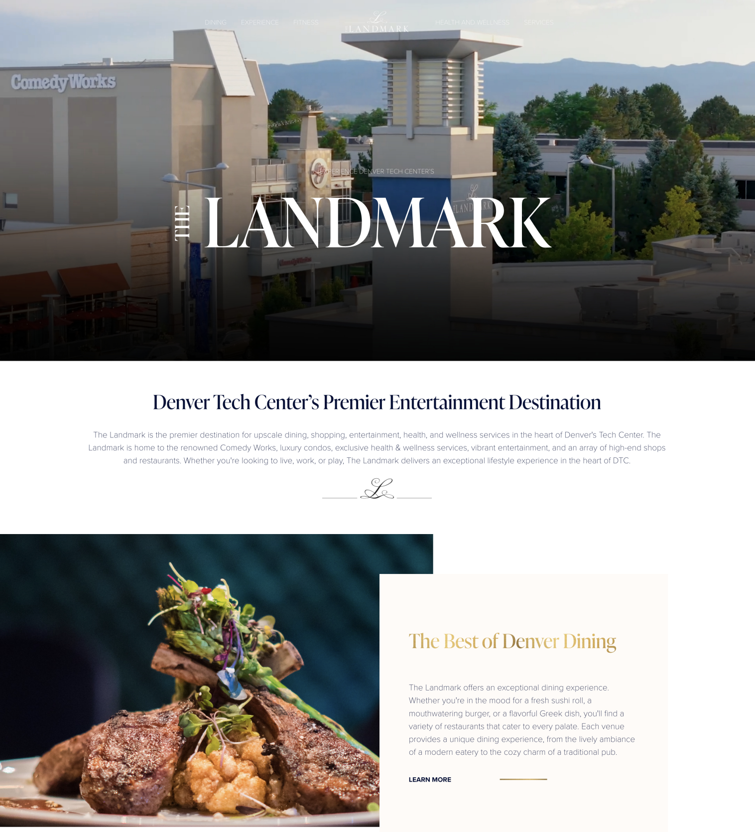Facade of The Landmark, a shopping and entertainment center in Denver, with trees in the background and clear skies.