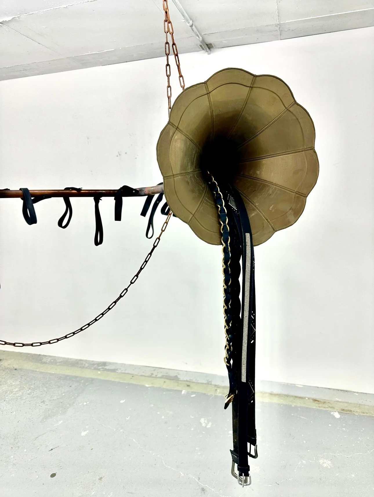 Tara Denny | I gave you everything but the ending, 2024 | scrap gramophone, women’s leather belts, copper, rivets, leather, chain | Courtesy of the Artist