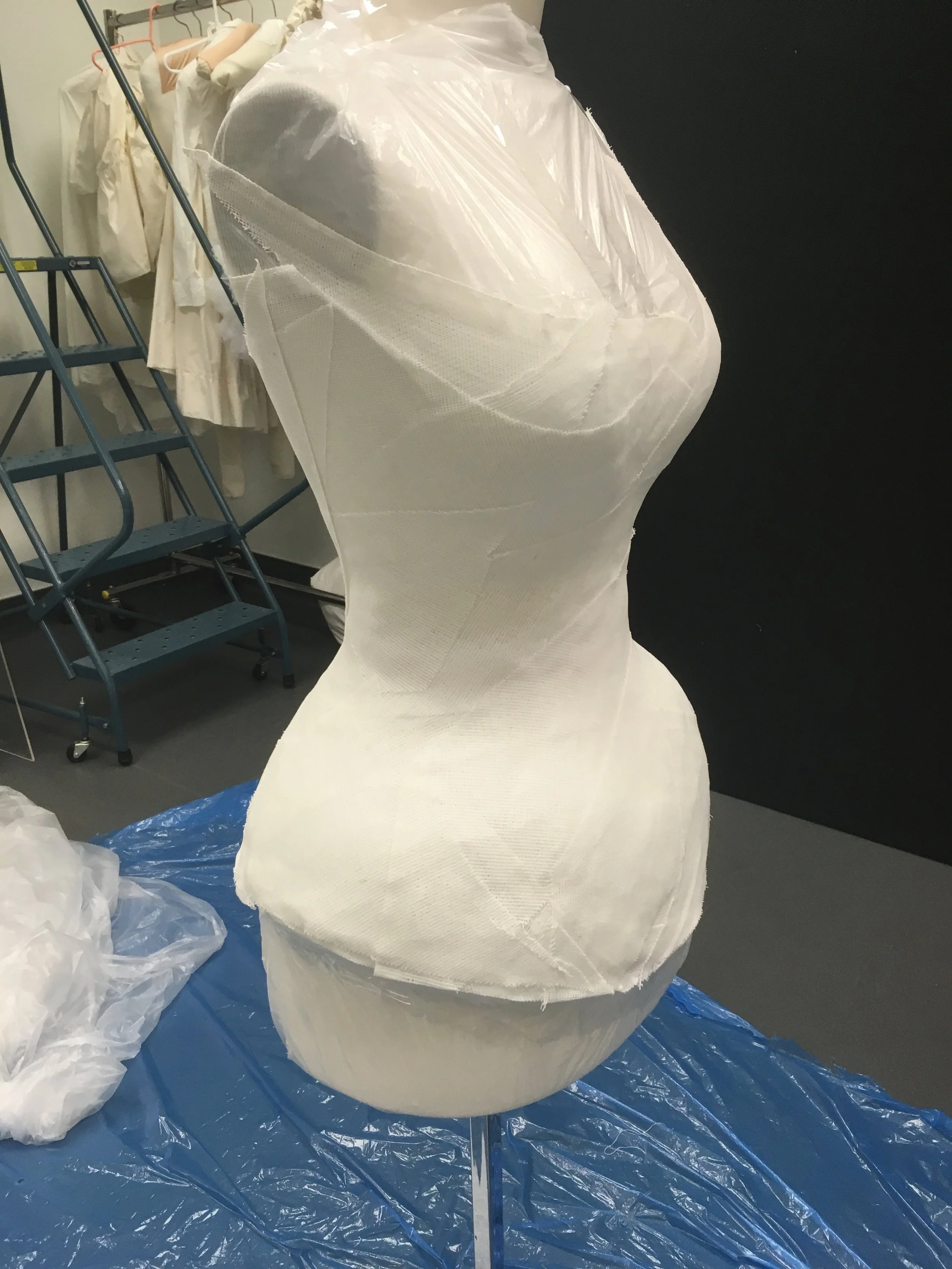 Buckram scraps were wet and added to the form in layers to made a hard cast.