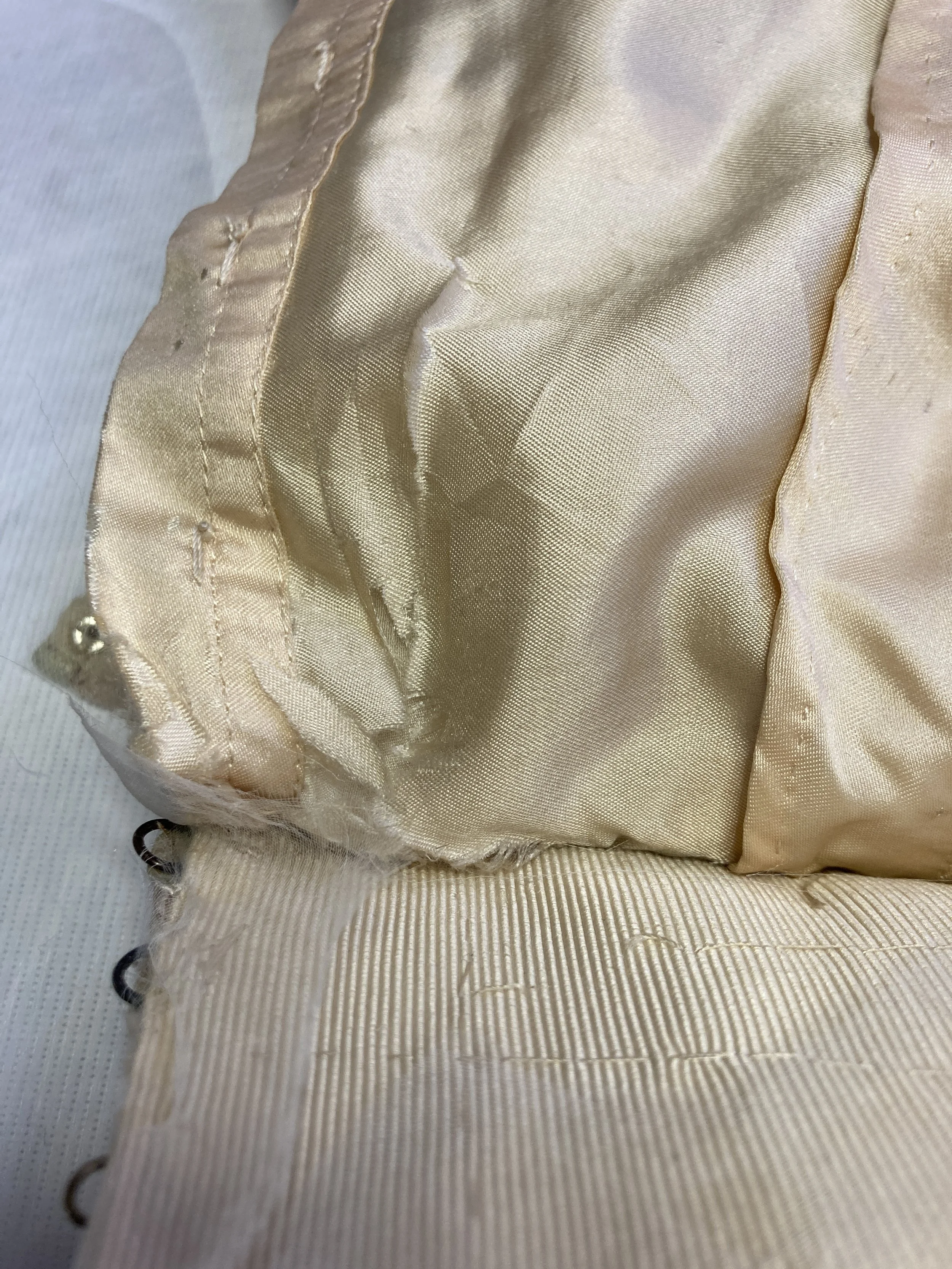 Before Treatment- Shattering skirt lining near back skirt opening.  Photo Credit: Margaret O'Neil