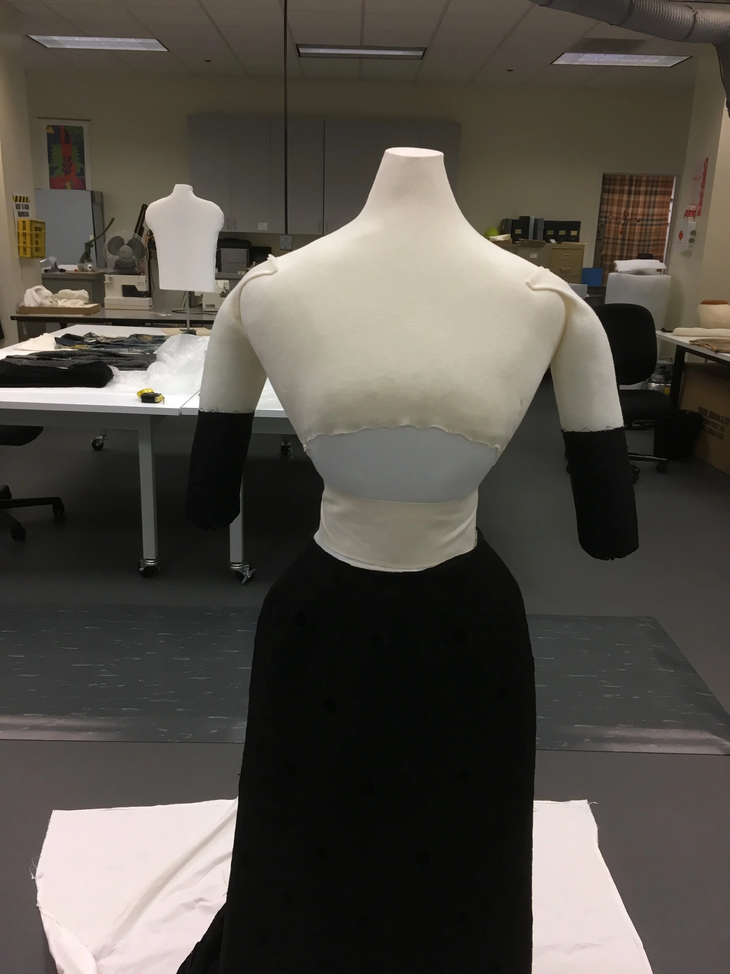 3/4 arms were added, made from stockinette and rolled polyester batting, and and covered with black silk.