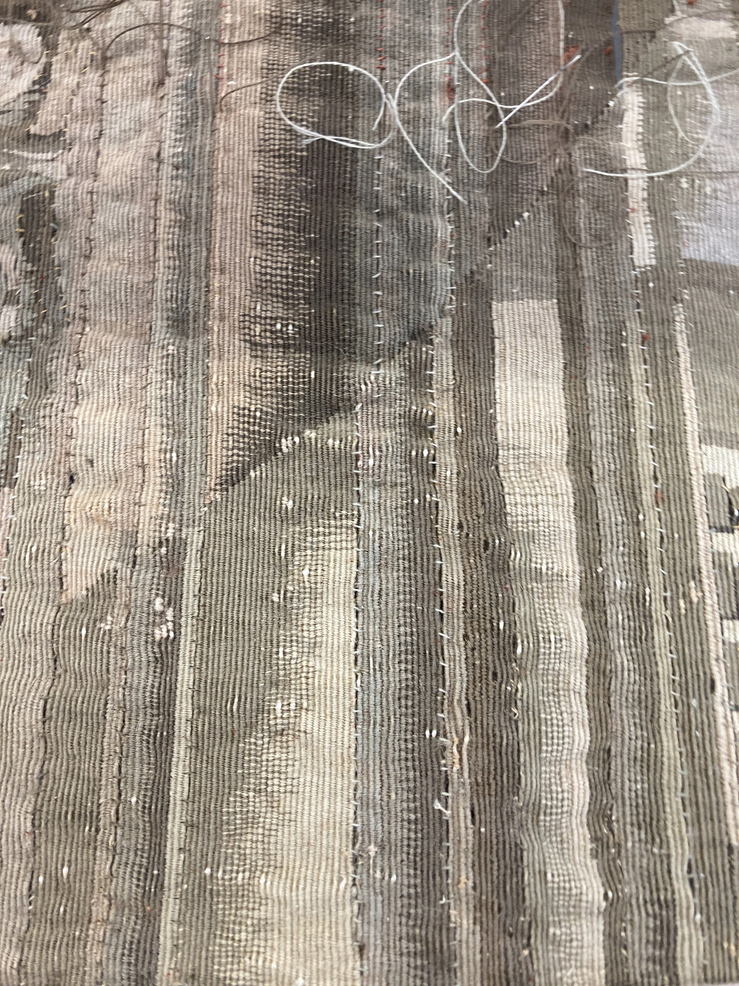 After Treatment, Long horizontal slits on PL figure scene with new strong thread. Photo Credit: Margaret O'Neil.