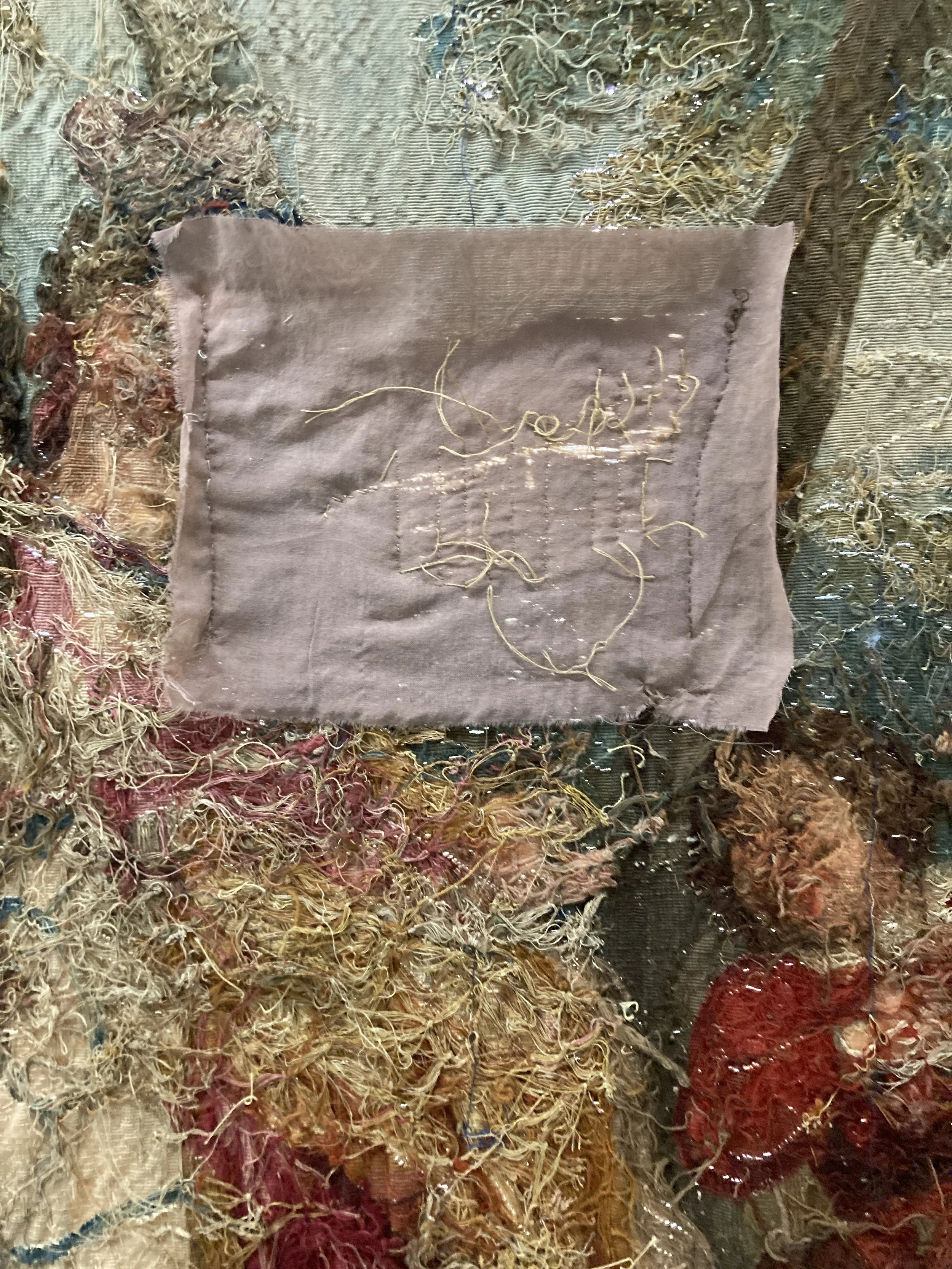 After Treatment, Patch on back on tapestry. Photo Credit: Margaret O'Neil.