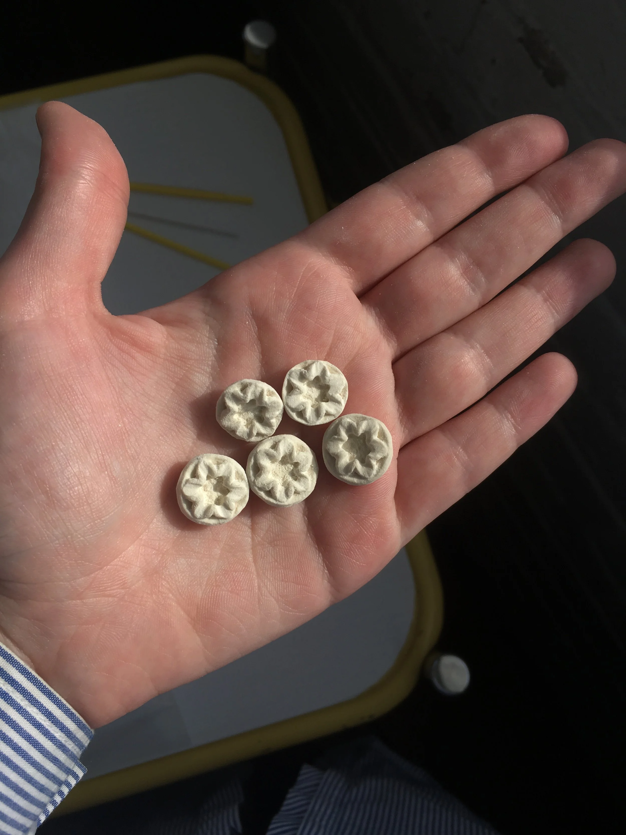 We used a jewelers saw and various files to shave down the mass.