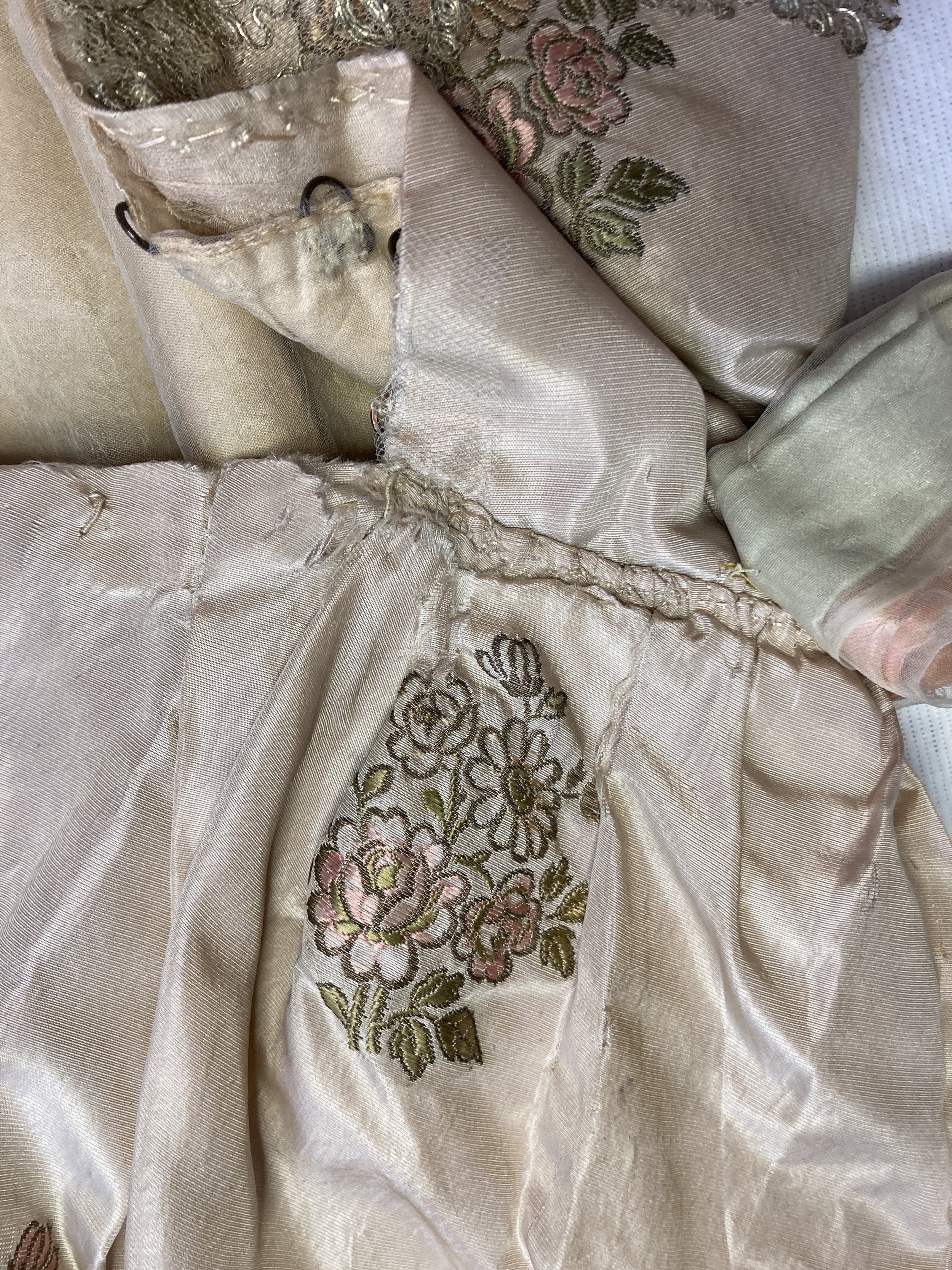 Before Treatment- Shattering silk along the top of the back skirt opening.  Photo Credit: Margaret O'Neil