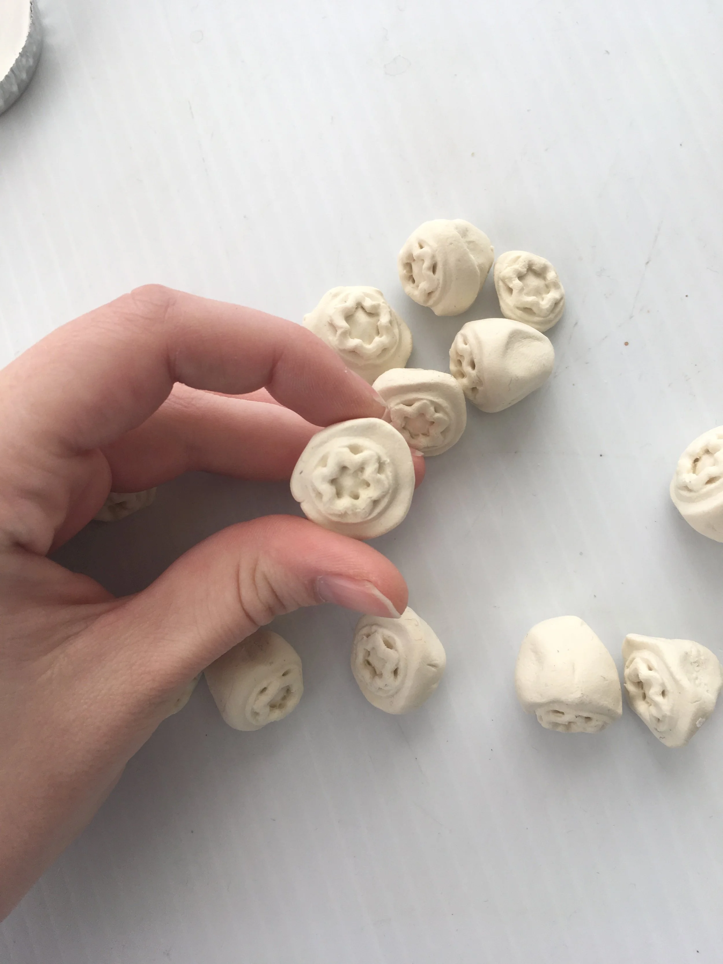 Large clumps of wood epoxy were squished into the mold and left to dry. The large mass allowed ease of release from the mold.