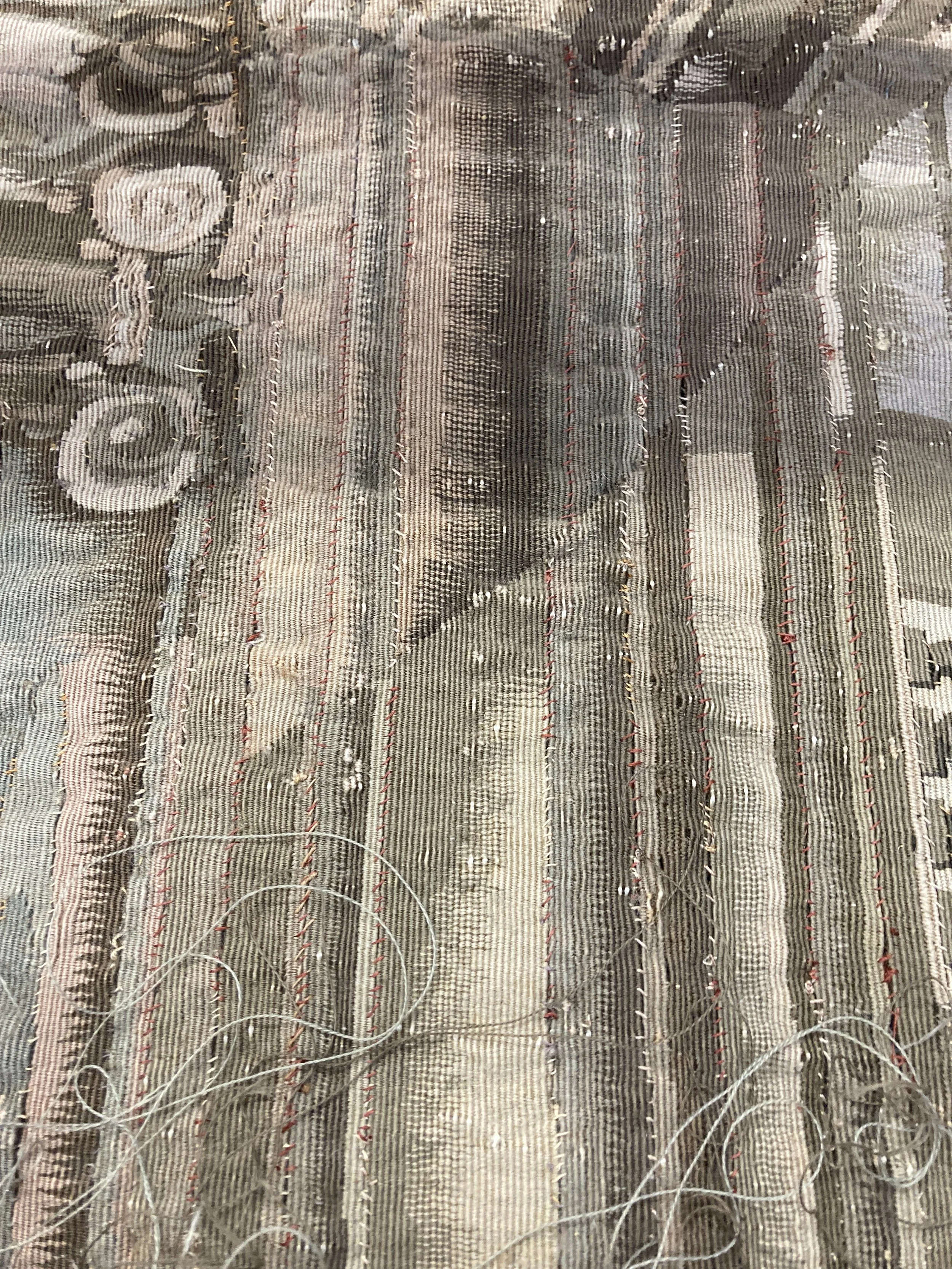 Before Treatment, Long horizontal slits in PL figural scene with fragile and red thread. Photo Credit: Margaret O'Neil.