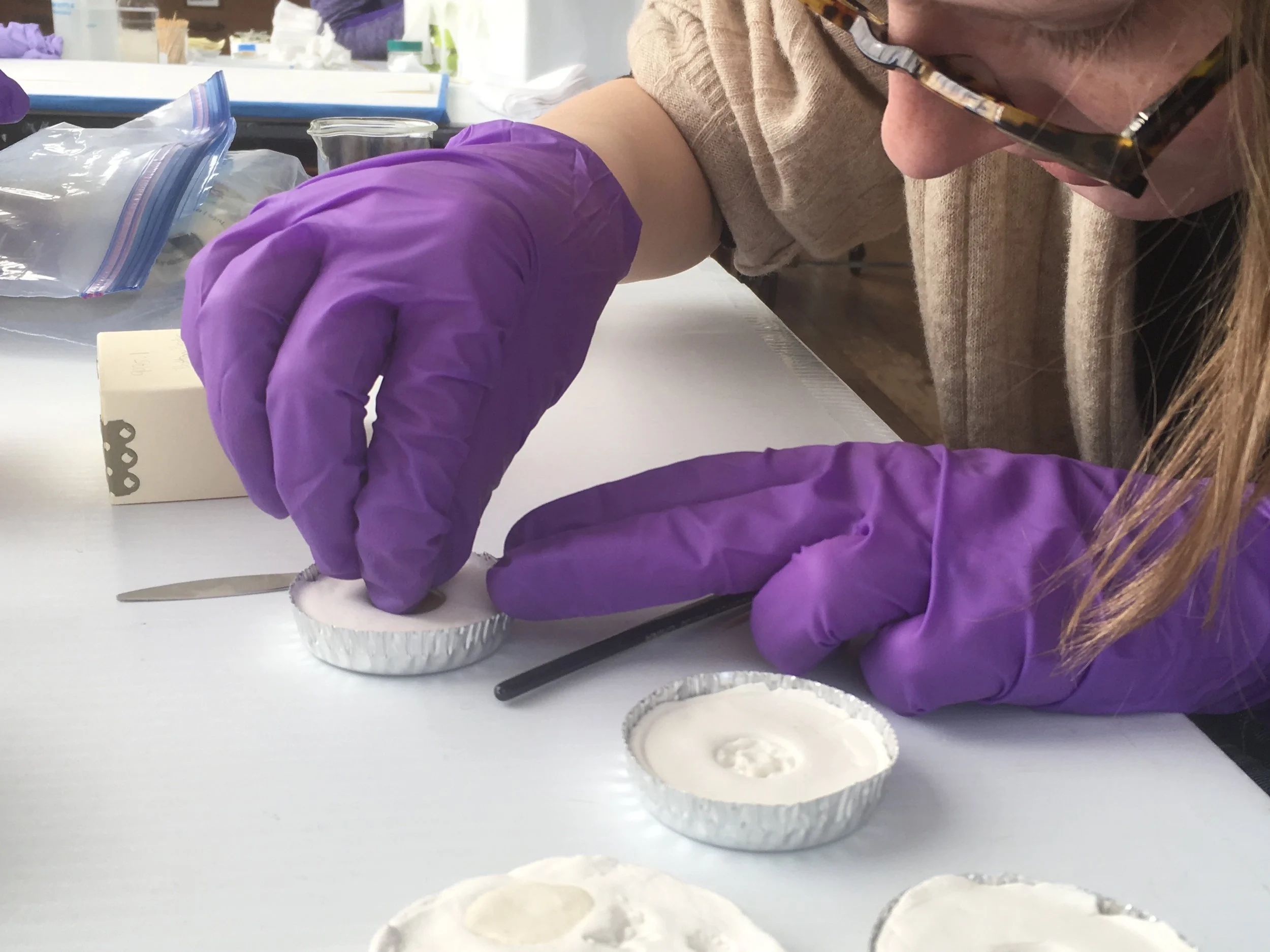 The original button (covered in aluminum release powder) was pressed into the air dry clay. The original was then cleaned with mineral spirits.