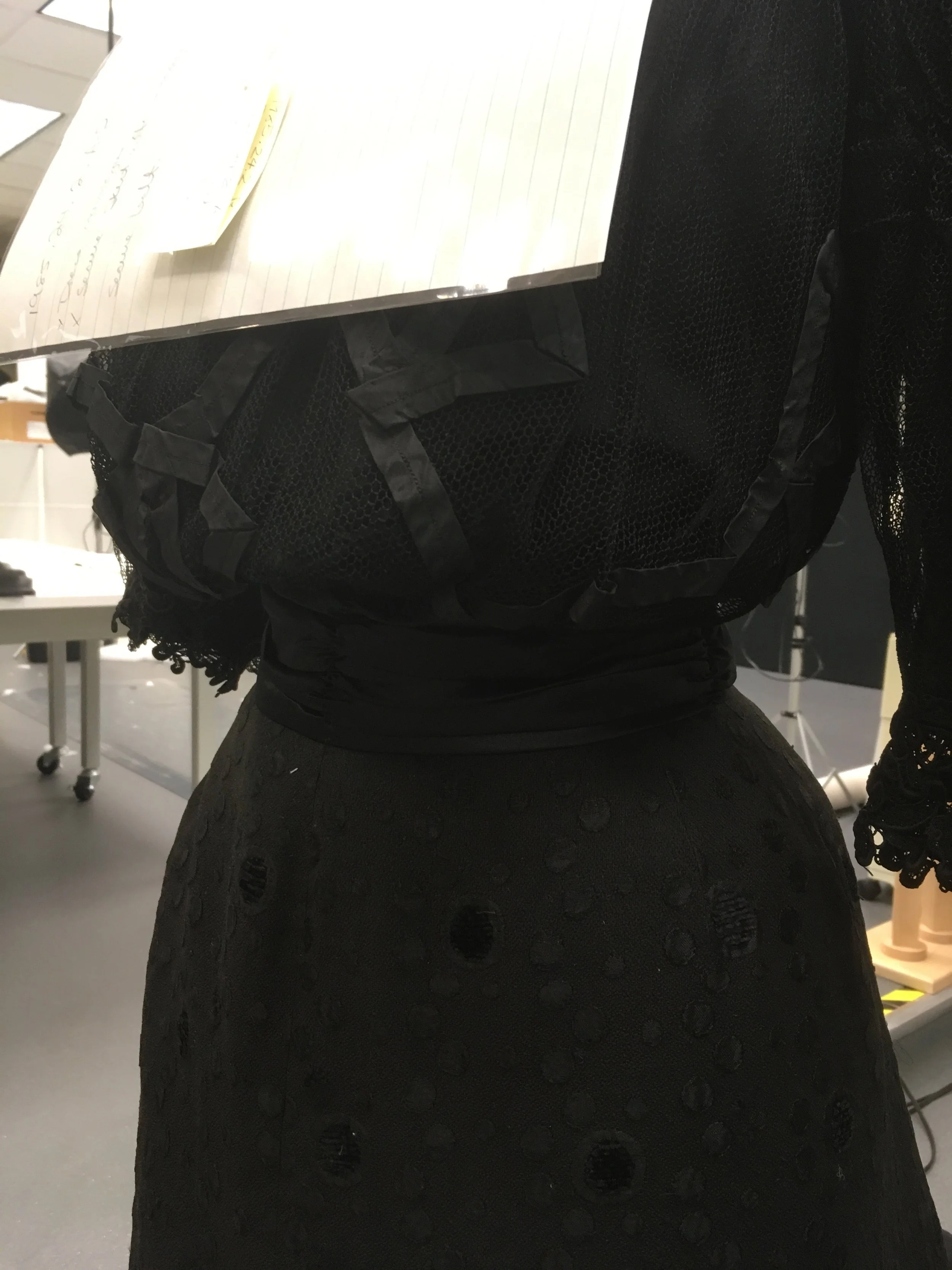 The final belt was constructed out of black silk and had plastic stays at the center back.