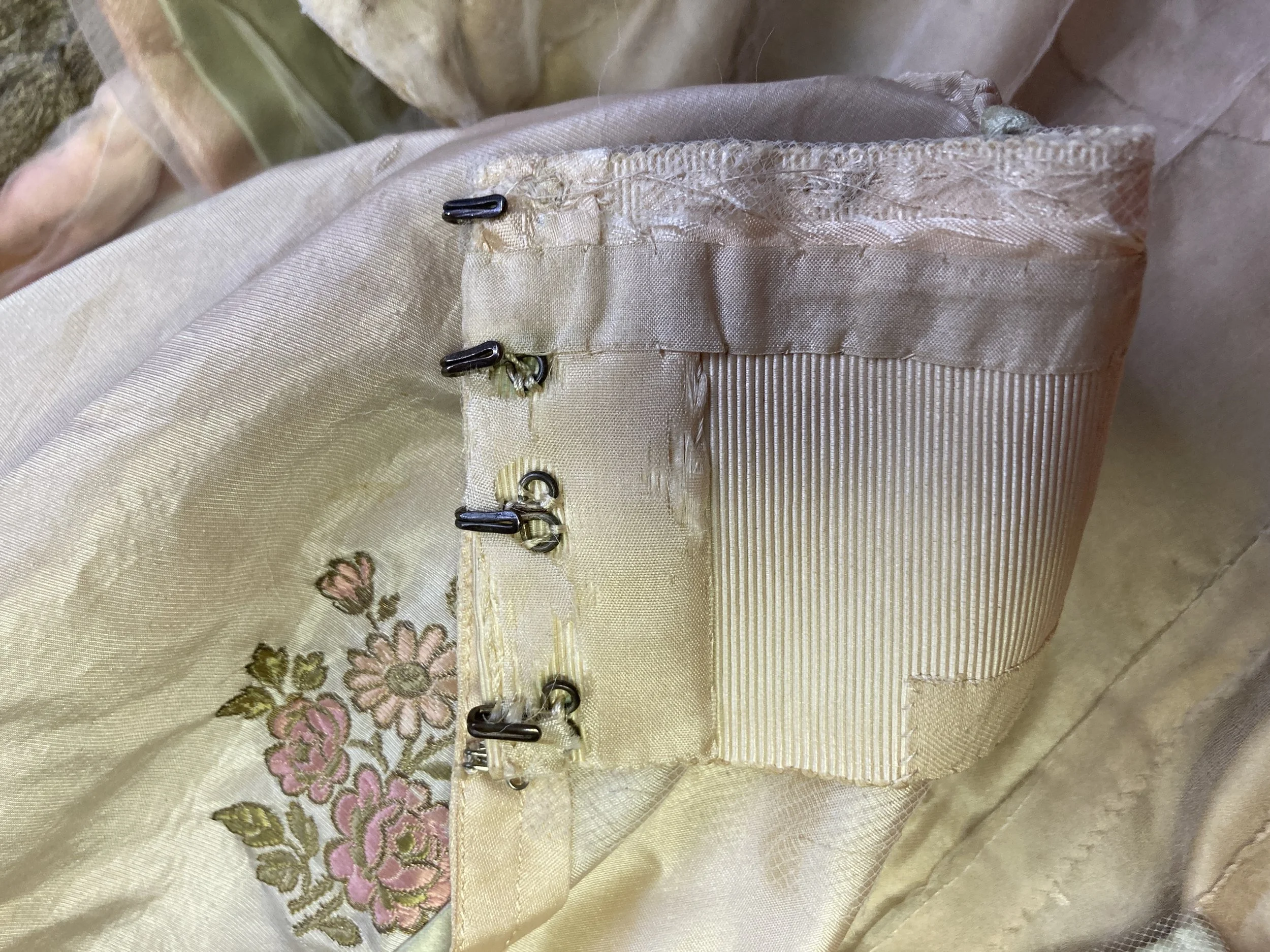 Before Treatment- Shattering silk hook facing.  Photo Credit: Margaret O'Neil