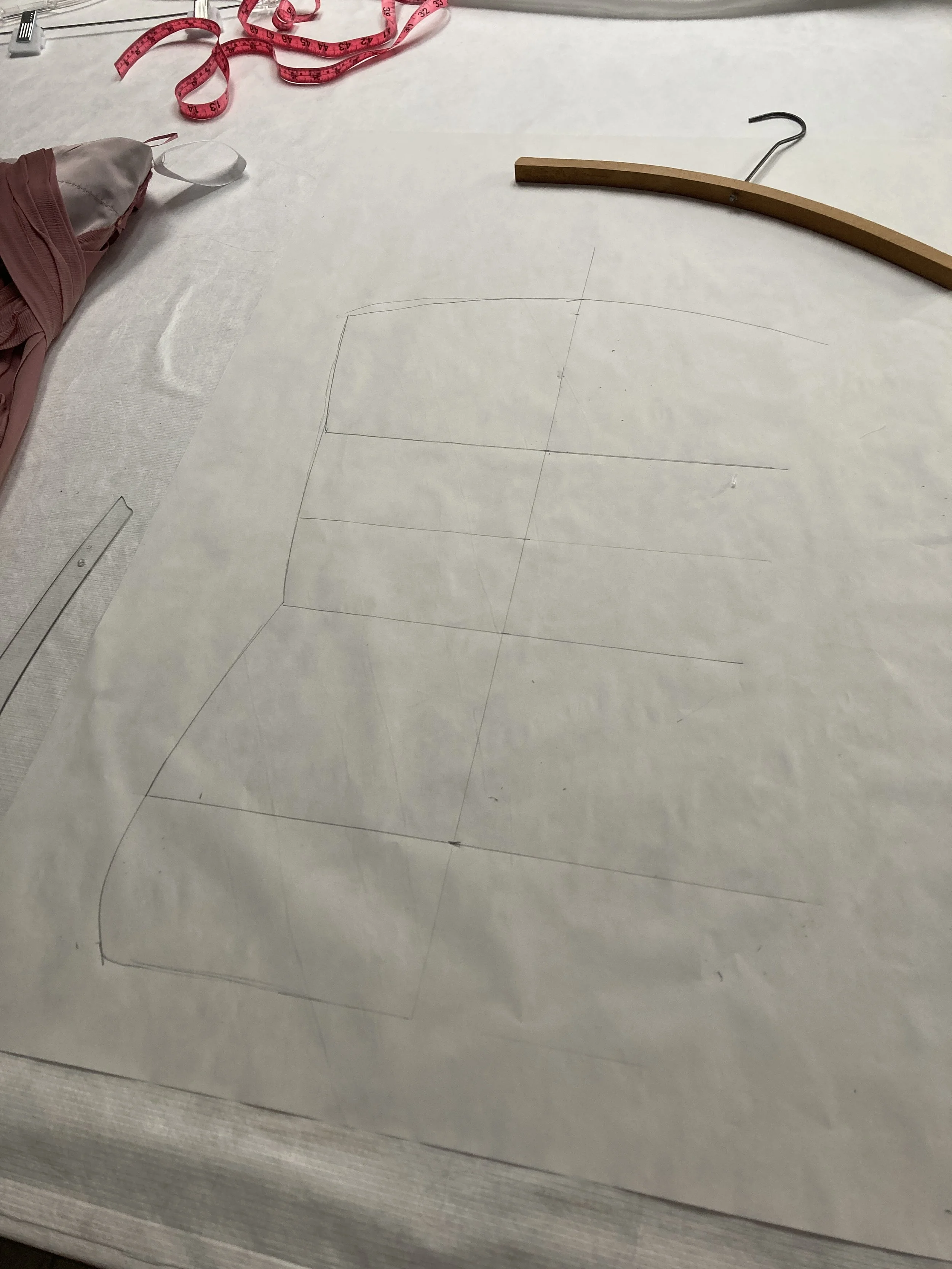 Chart your measurements on a pattern and trace the slope of the hanger. You can do this on blue-board is you are experienced.