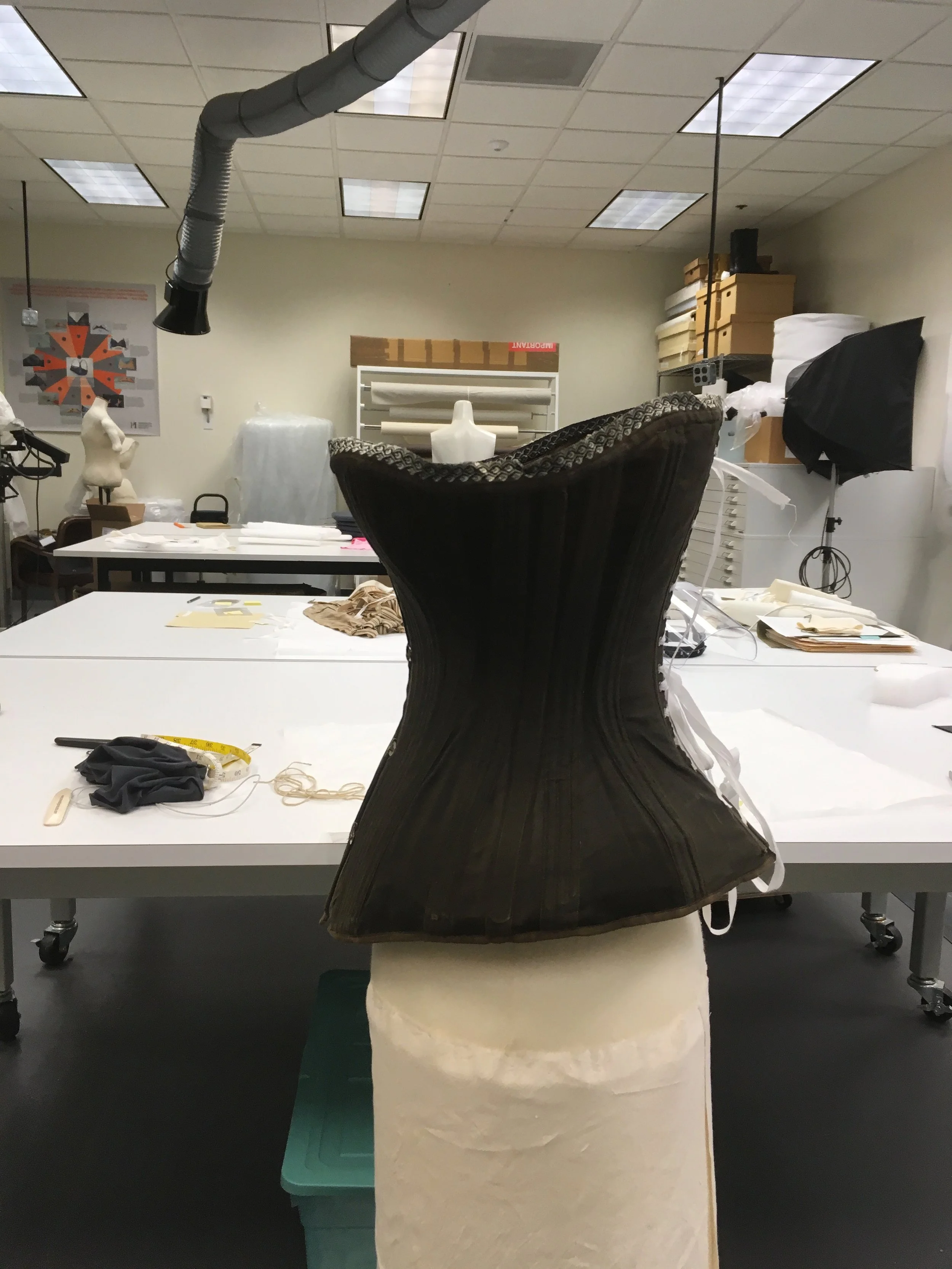 Fit the corset for a final time.