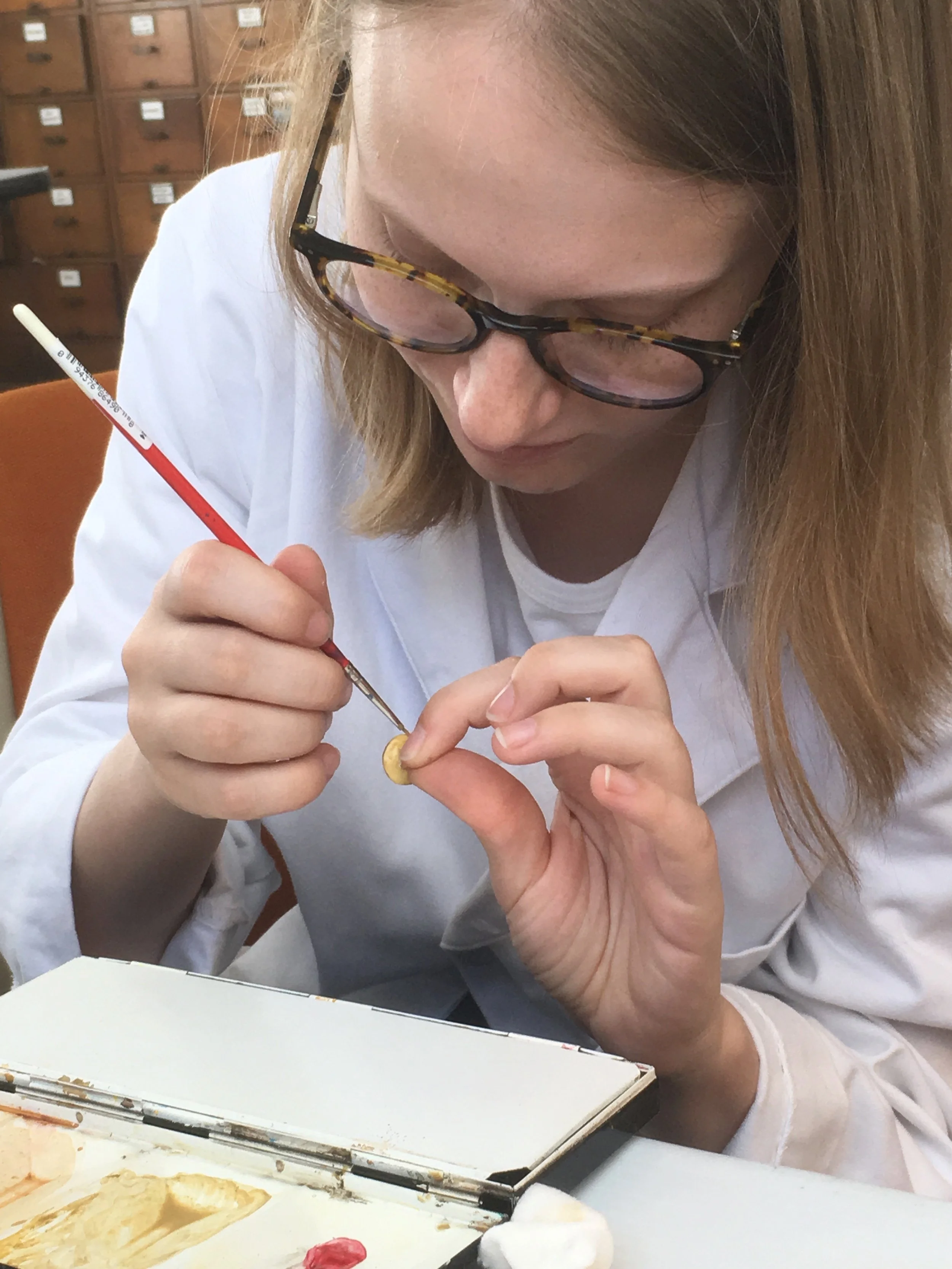 The buttons were painted with acrylic washes.