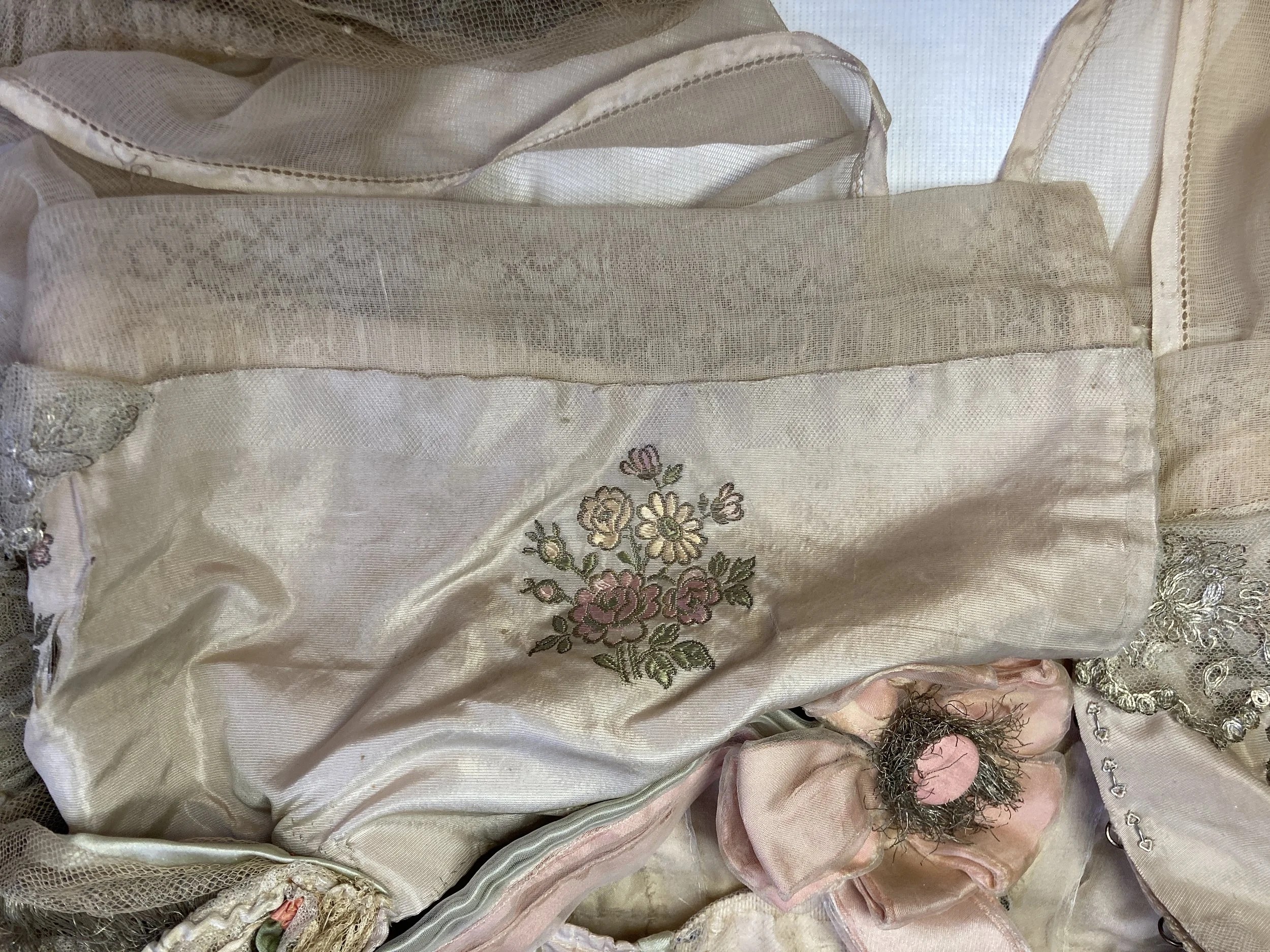 After Treatment- Silk shattering along fold on back bodice consolidated with nylon net overlay.  Photo Credit: Margaret O'Neil.