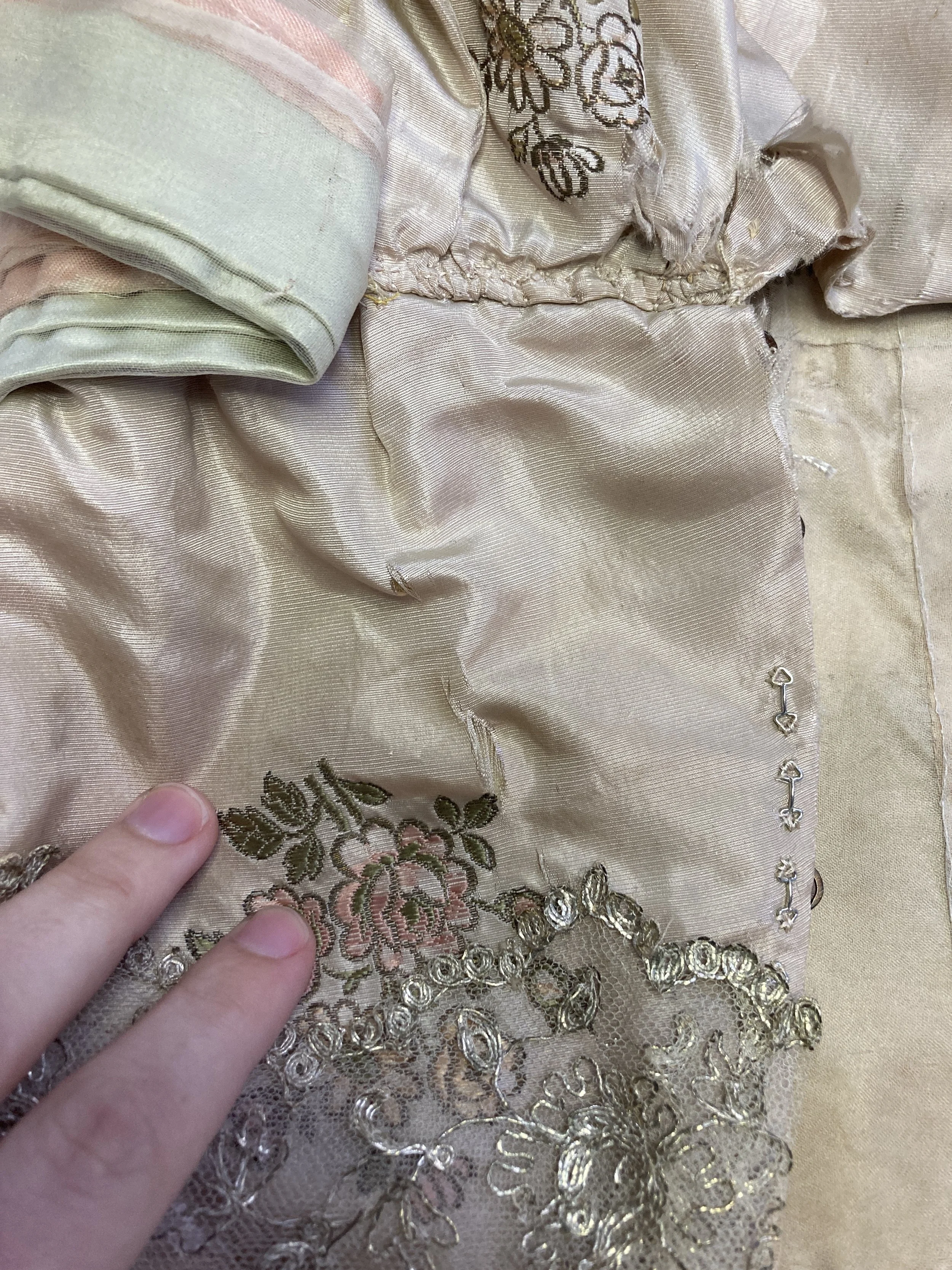 Before Treatment- Splits in back bodice. Photo Credit: Margaret O'Neil
