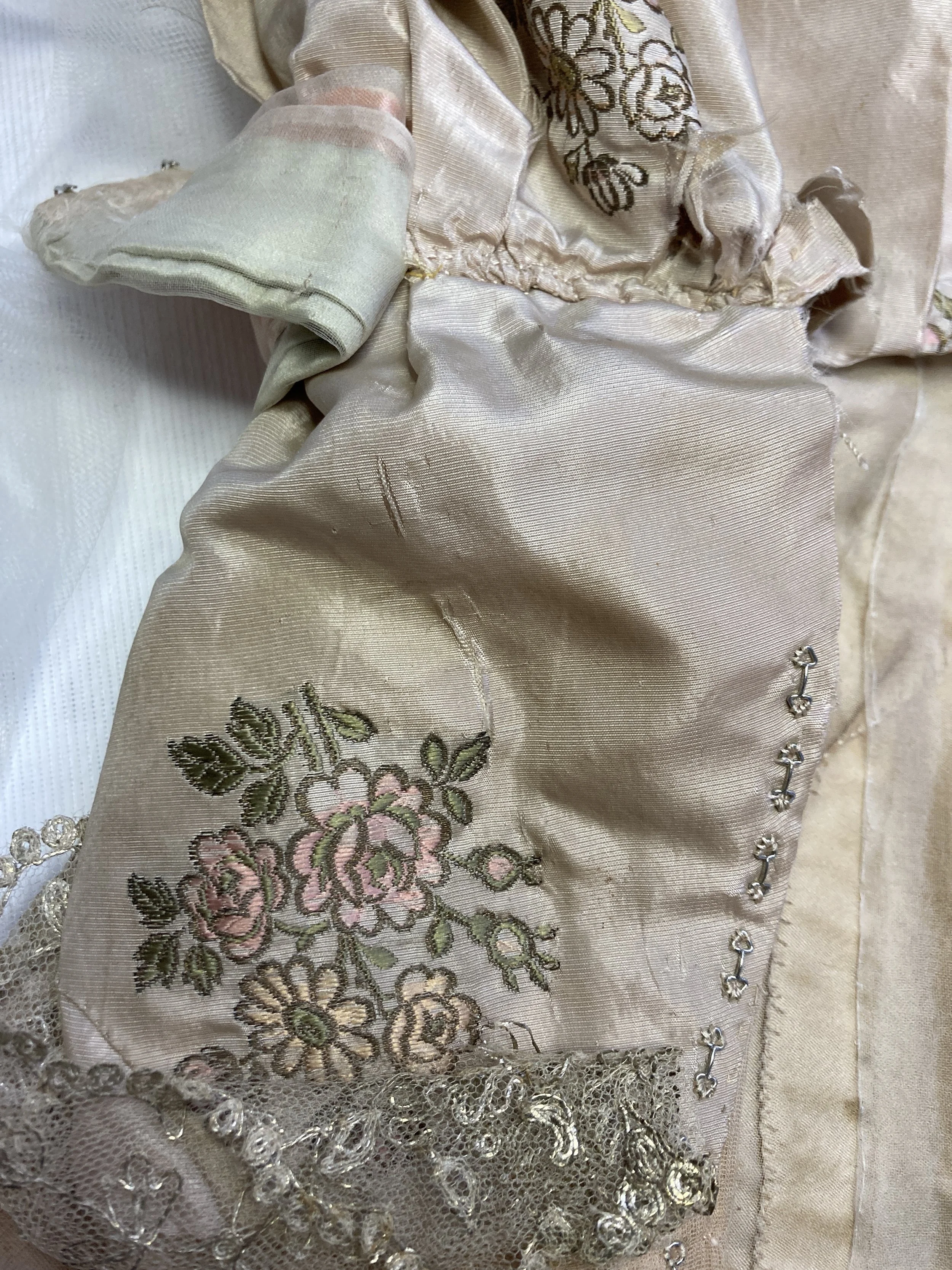 After Treatment- Splits in back bodice consolidated with laid and couching stitches.  Photo Credit: Margaret O'Neil