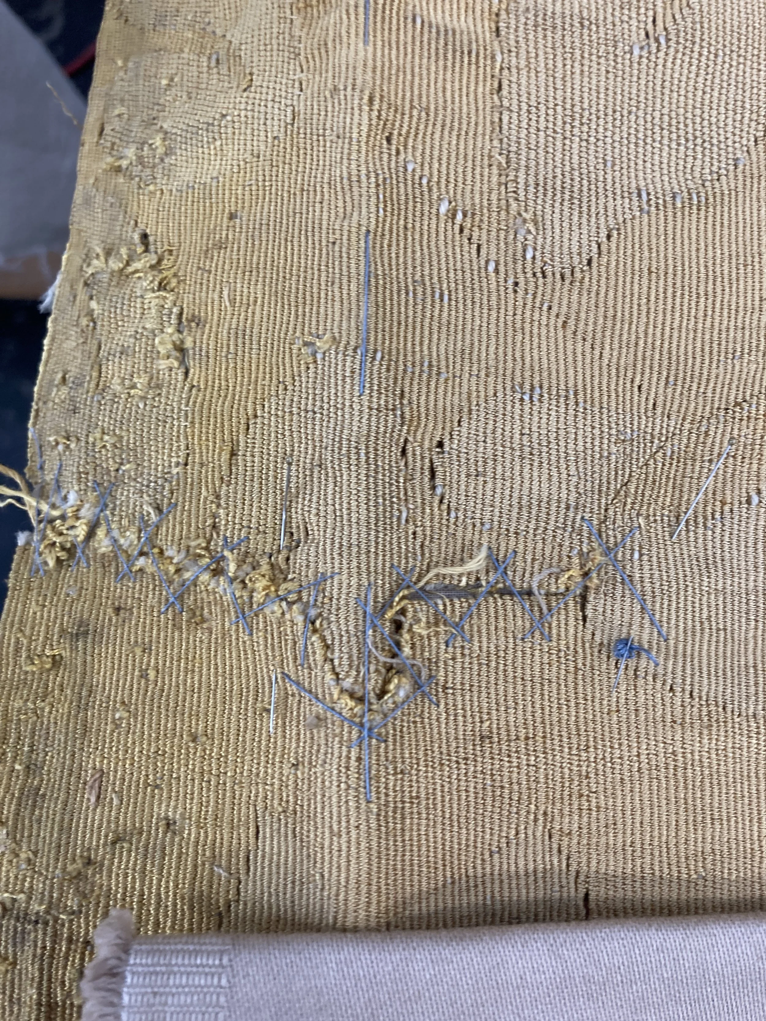 Before Treatment, Split in seam along top edge. Photo Credit: Margaret O'Neil.