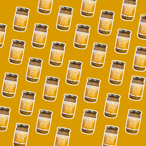 Multiple jars of Fix & Fogg Peanut Butter arranged diagonally on a yellow background.