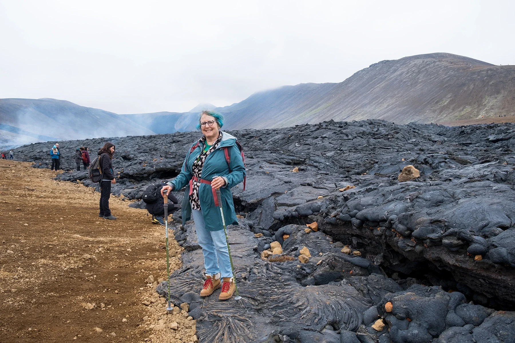 Traveler with reduced mobility exploring a volcanic lava field in Iceland on a private accessible guided tour