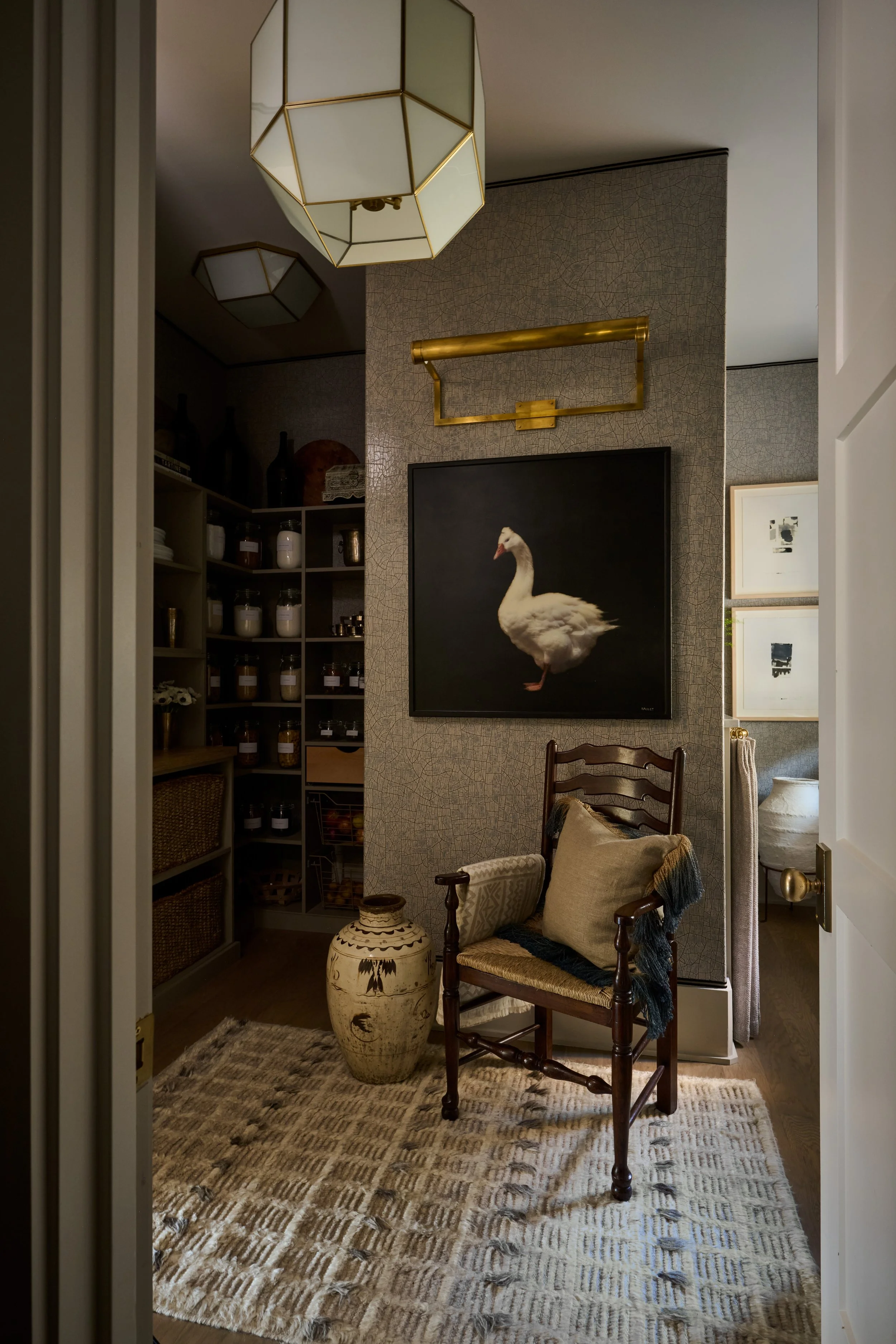 Serenbe Showhouse 2025 Pantry Vestibule. Wallpaper from Arte Wallcoverings at Paul Plus with a Holly Hunt Tape Trim Border. Chandelier from Visual Comfort. Area rug from Moattar Rugs. Layered with contrasting art from Dawne Raulet and antique pieces.