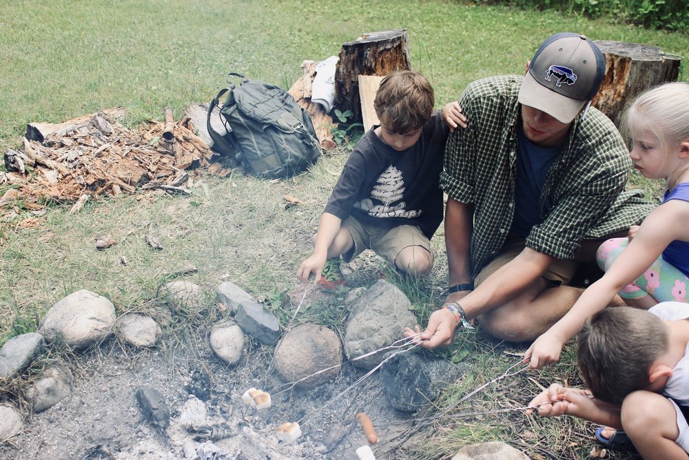 WILDERNESS_young-kids-cooking-around-fire-with-adult-EDITED.jpeg
