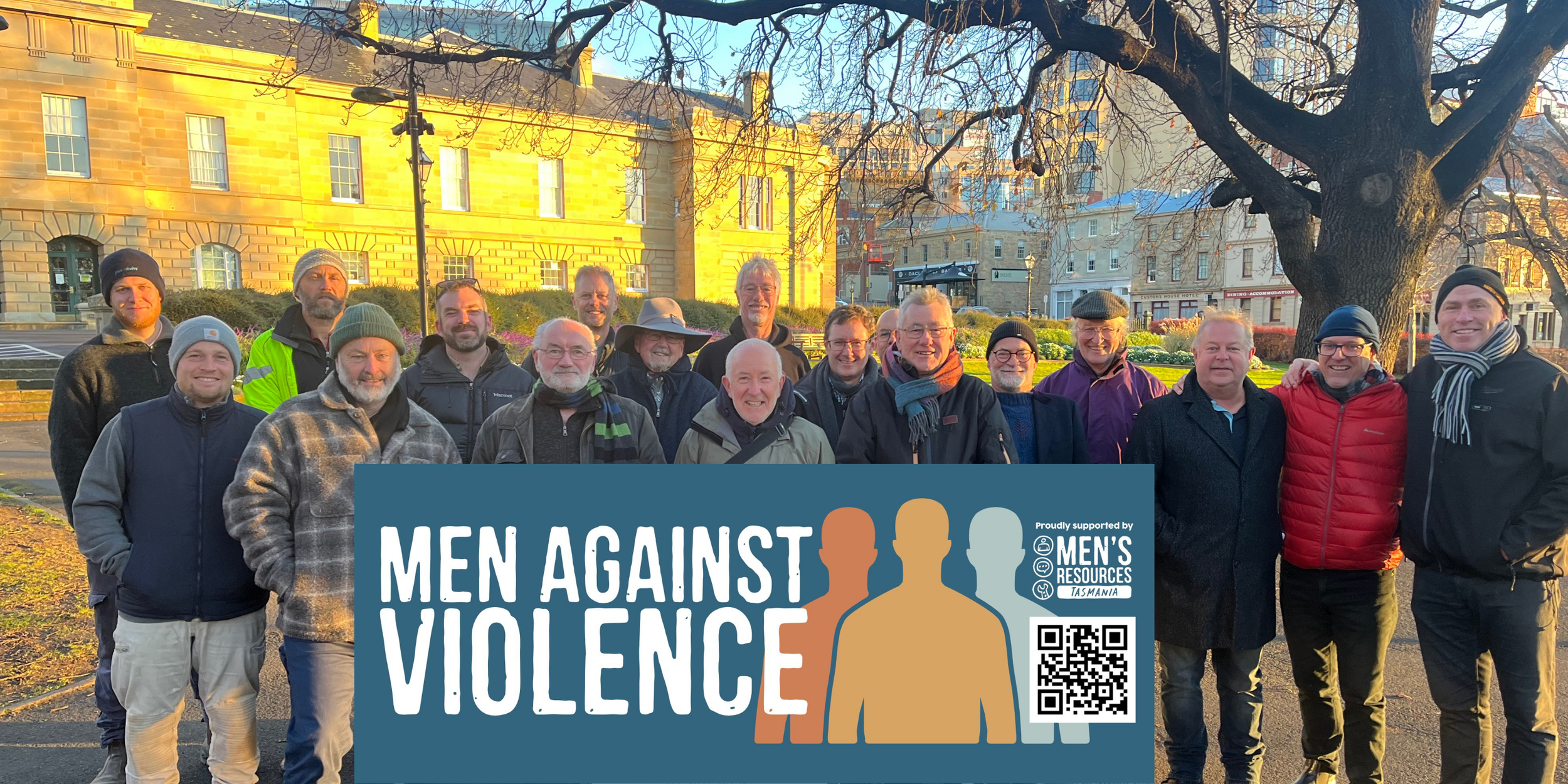 A group of men outside Tas Parliament House standing against violence.