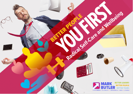 A disheveled man with glasses and a loosened tie appears to be exhausted or overwhelmed at an office desk surrounded by empty coffee cups, a calculator, a phone, and scattered office supplies. Overlaid text promotes self-care and well-being for better people and leadership.