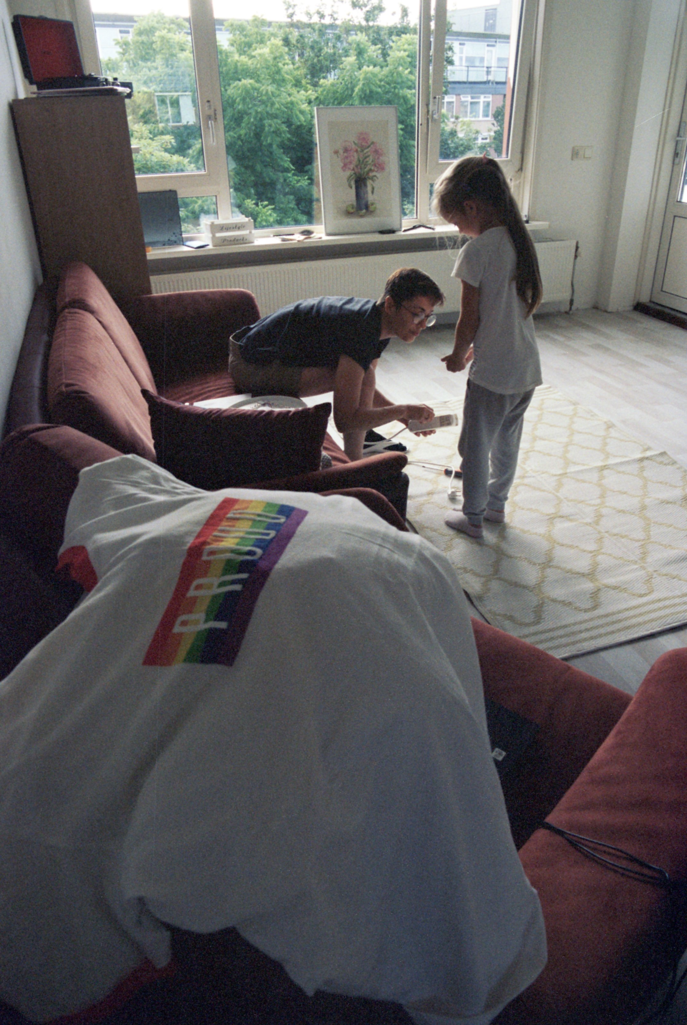 Olga and Sofia fixing electricity at home. Olga's t-shirt for her first ever PRIDE laid out on the couch.
If things in Russia were different, more LGBTQ families would have kids. These are conscious children, they are never "an accident". People ar