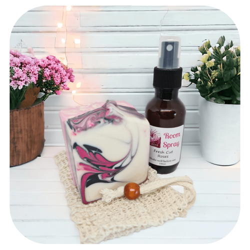 lLadies gift box with handmade soap, room spray and soap sack, styled with flowers on white background