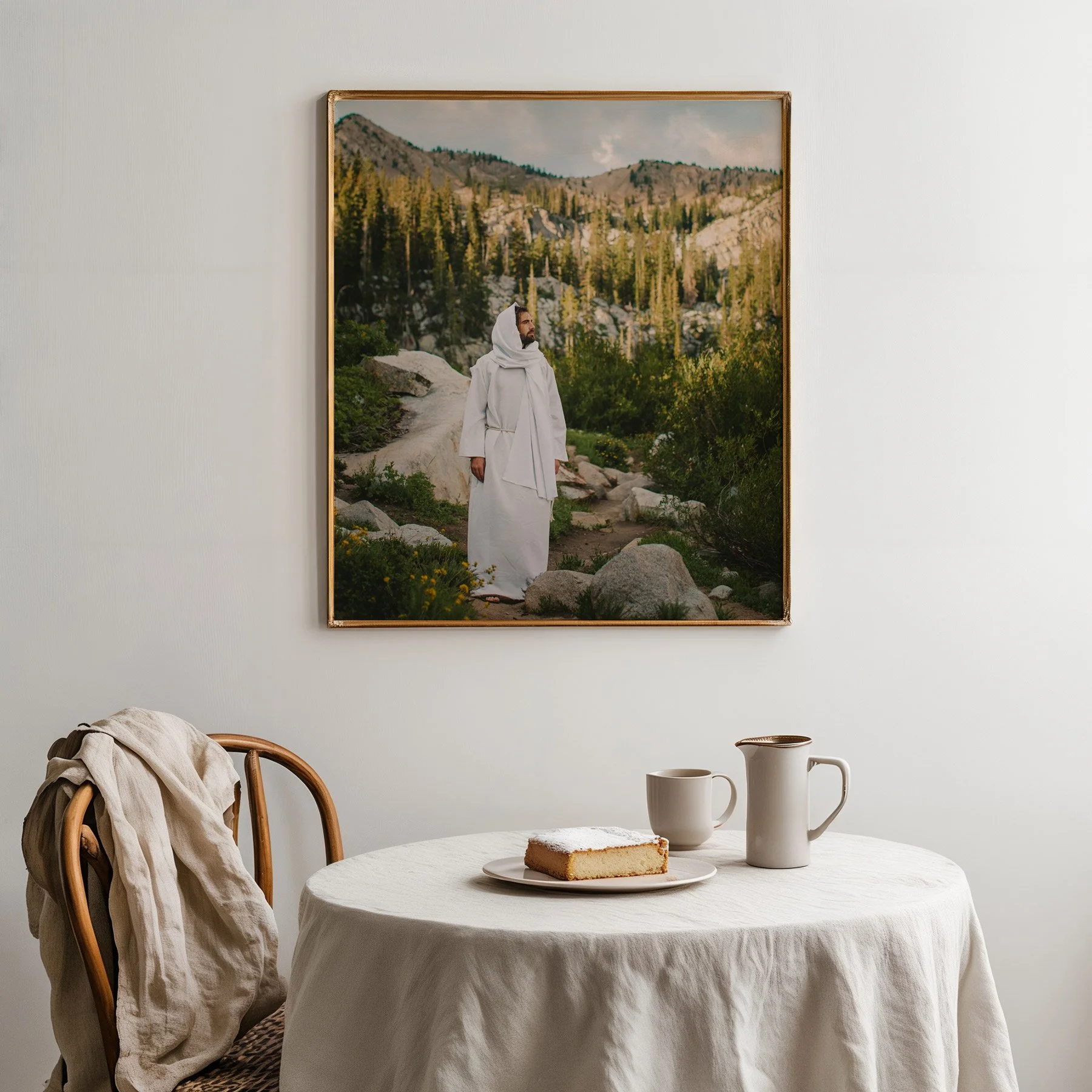 Fine art print of Jesus walking in the forest, styled with simple rustic decor and white tablecloth.