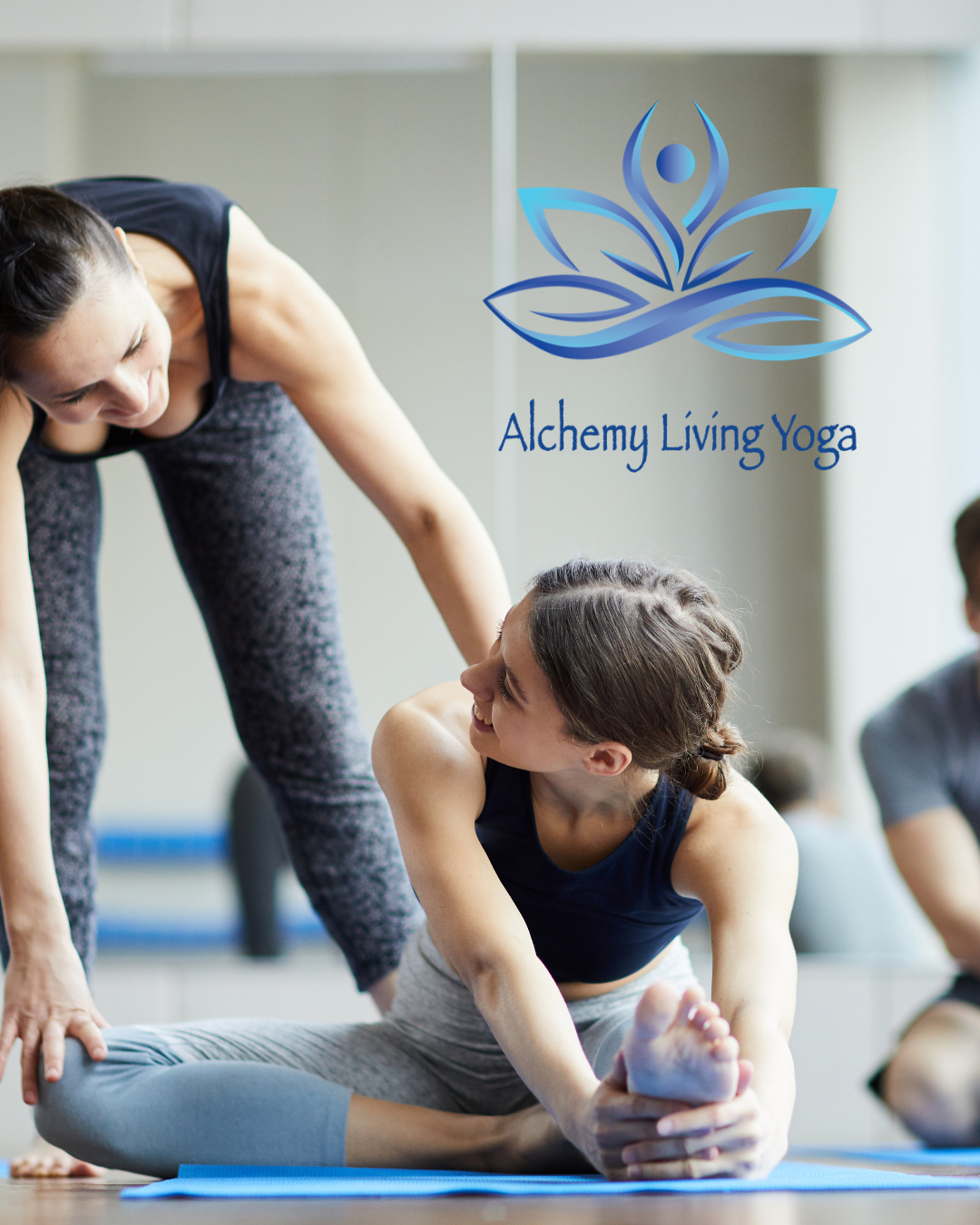 Small group yoga class with personalized instructor guidance at Alchemy Living Yoga
