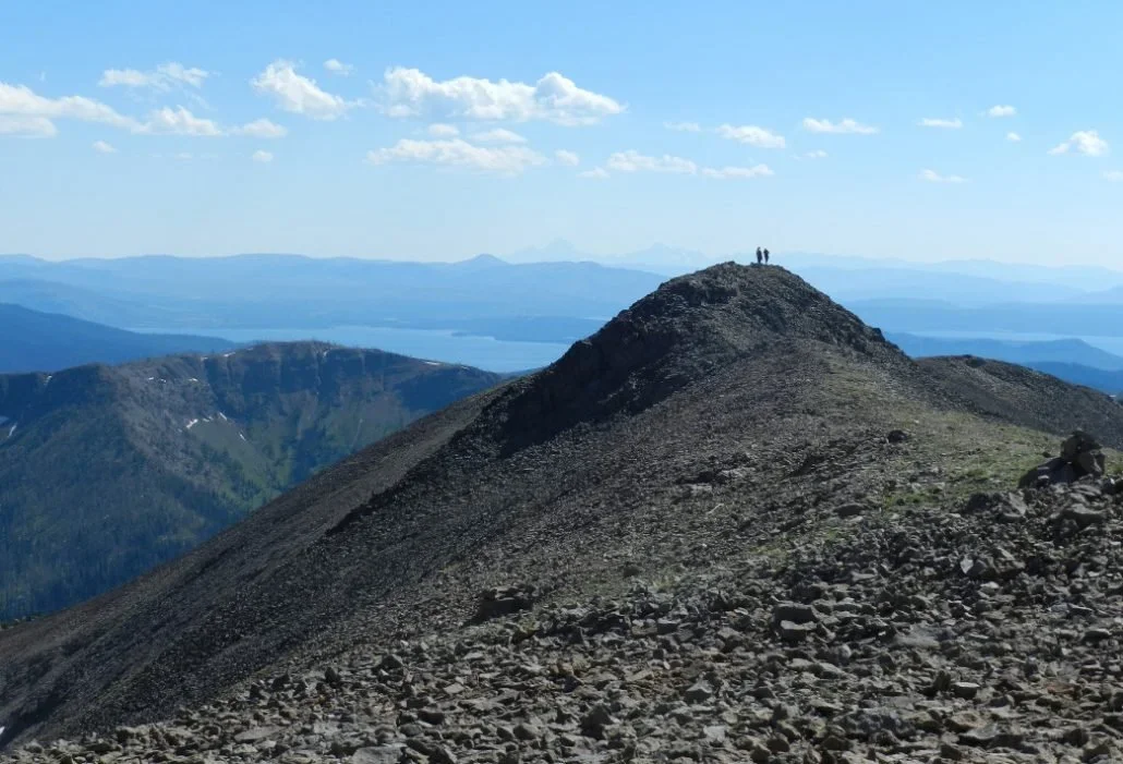 Hikers stand atop Avalanche Peak.  Photo courtesy of the NPS