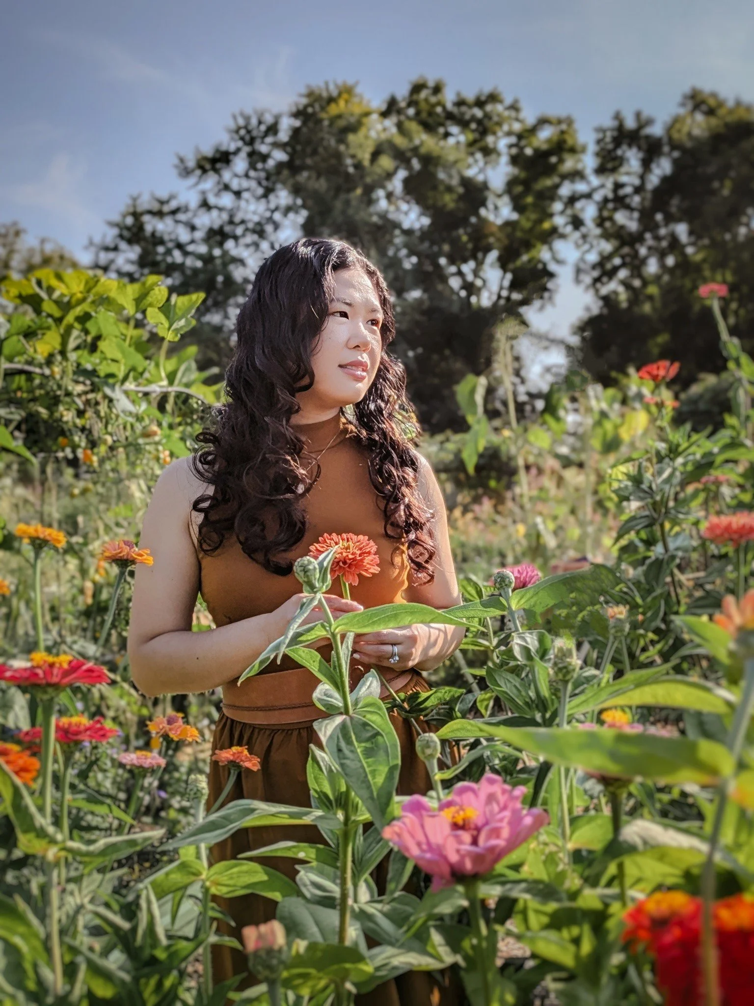 Cecille in the floral garden with a highlight of the colorful flowers and green stems