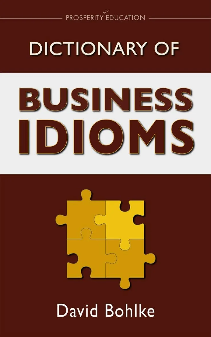 Business idioms dictionary cover showing a jigsaw image